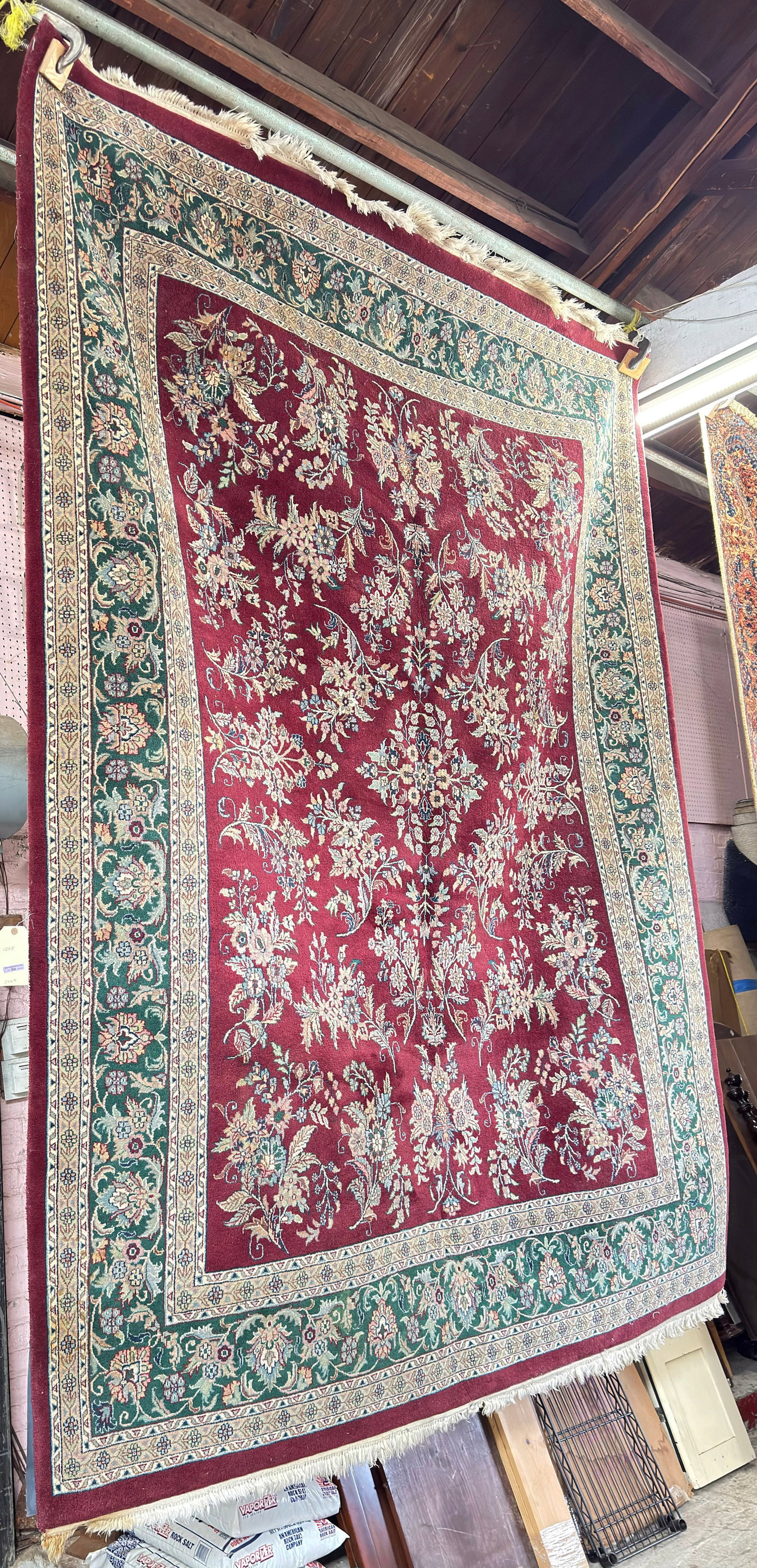 8' x 10' Handwoven Sarouk Style Rug, Red Field.: The rug looks to be in good overall condition. In house shipping is available for this rug. Please see our website for in house shipping procedures.