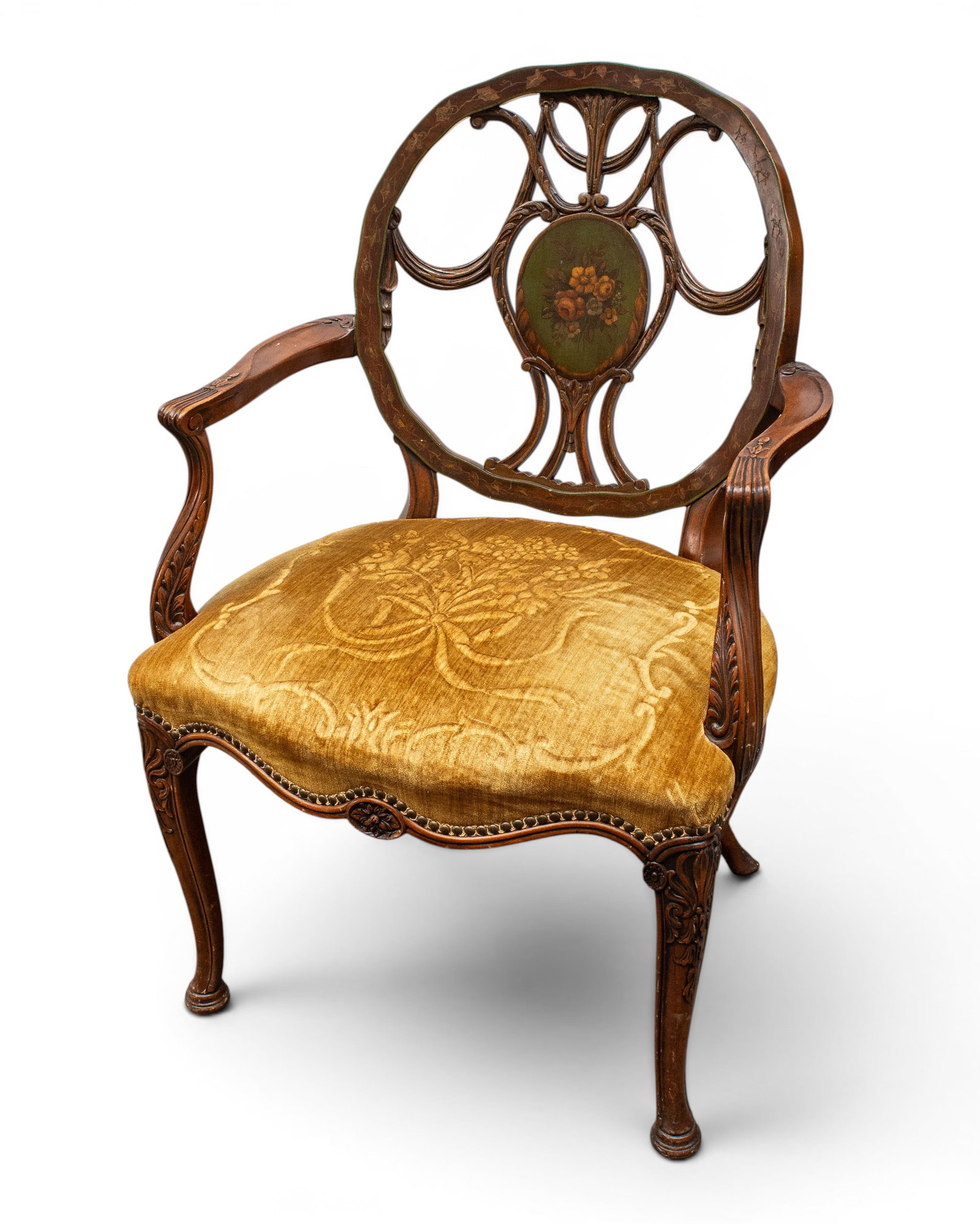 Carved & Upholstered Painted French Armchair.: This chair has a circular pierced back with carvings and handpainted flowers. The upholstery is gold with an embossed raised floral design and nailhead trim. Overall, the piece is in good condition, w