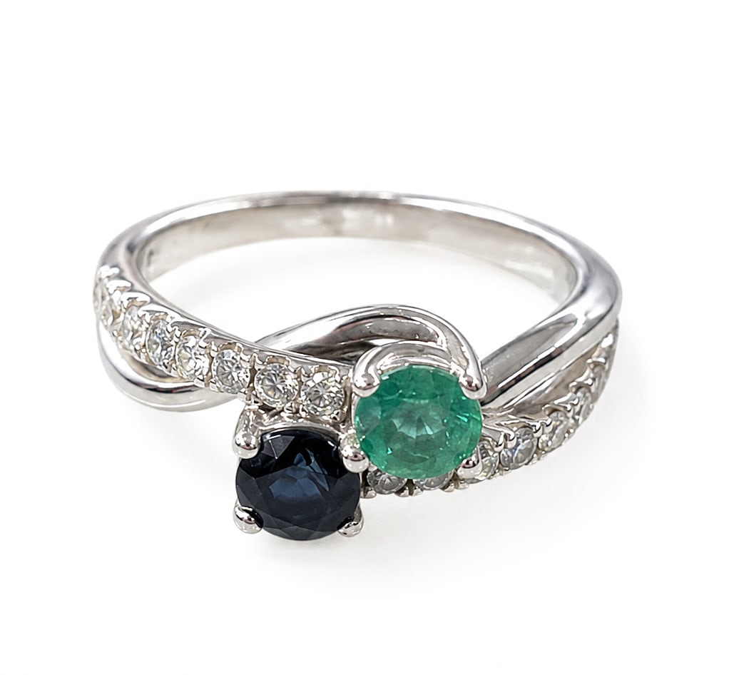 "Ever Us" 14K White Gold Sapphire & Emerald Ring.: The ring is marked Ever Us inside the band, and tested appropriately for 14K gold. It features a round cut dark blue sapphire and green emerald, with a row of small diamonds on each side. The main sto