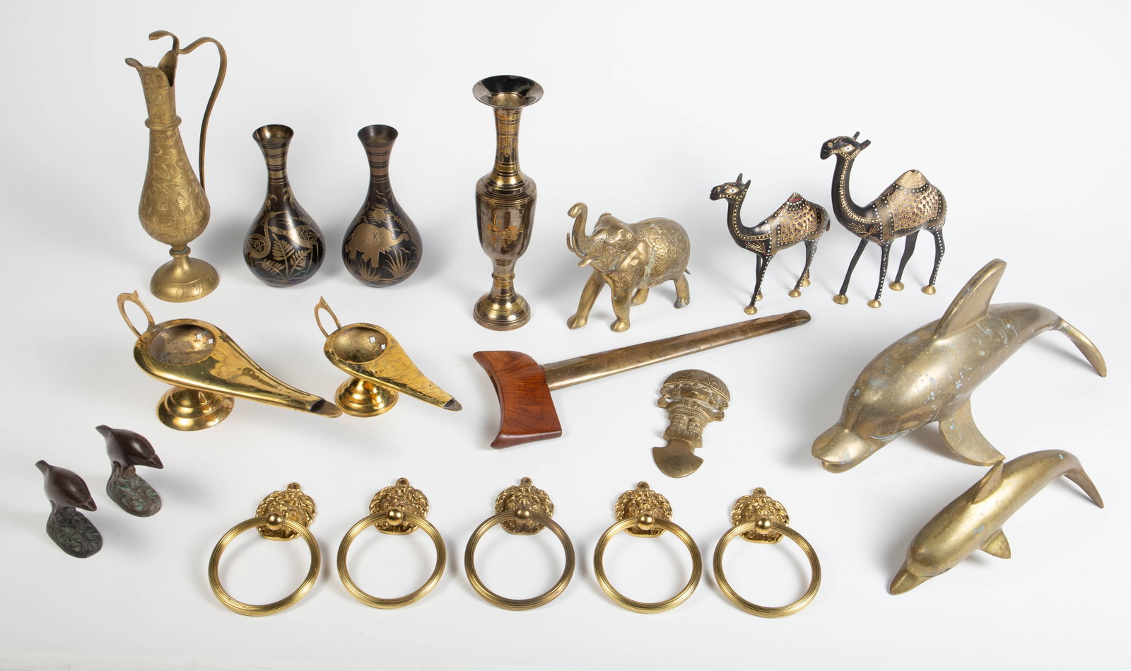 Lot of Brass & Bronze Items - India, Peru, Animals: The lot contains 18 items. They have etched, cast, or handpainted decorations. There are 2 India vases and a pitcher, a mid century modern vase, dolphin figures made in California, elephant figures, c