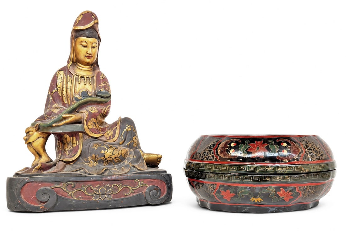 Lot: Chinese Lacquered Box & Guanyin Sculpture.: The lot contains 2 items. There is a round lacquered hand painted box with a dragon and a phoenix. It measures 6 3/8" tall, and 13 1/4" in diameter. The sculpture is carved wood, and features Guanyin.