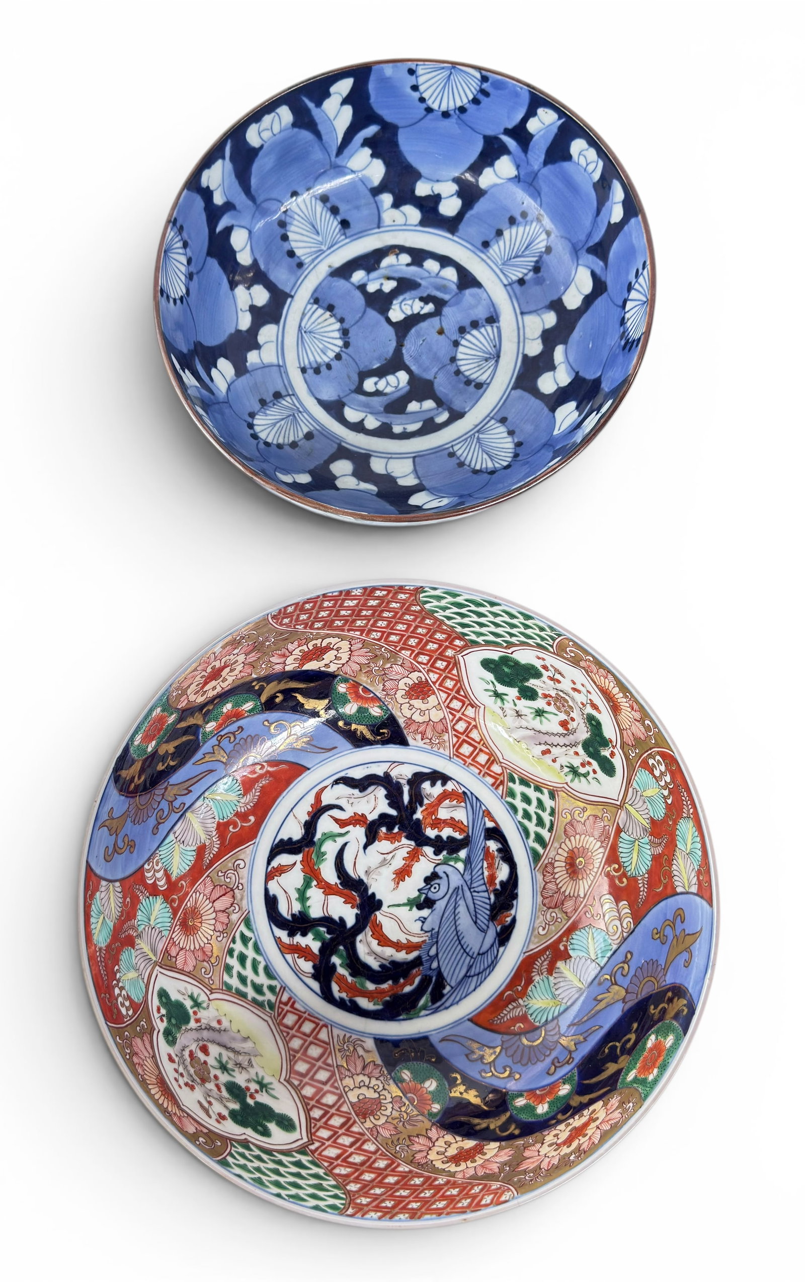 Lot 2 Lg. Japanese Porcelain Bowls - Blue & Imari.: The blue and white bowl measures 3 7/8" tall, and 9 1/2" in diameter. The Imari bowl measures 4 3/4" tall and 10 5/8" in diameter. There is a surface crack on the underside of the Imari bowl inside th