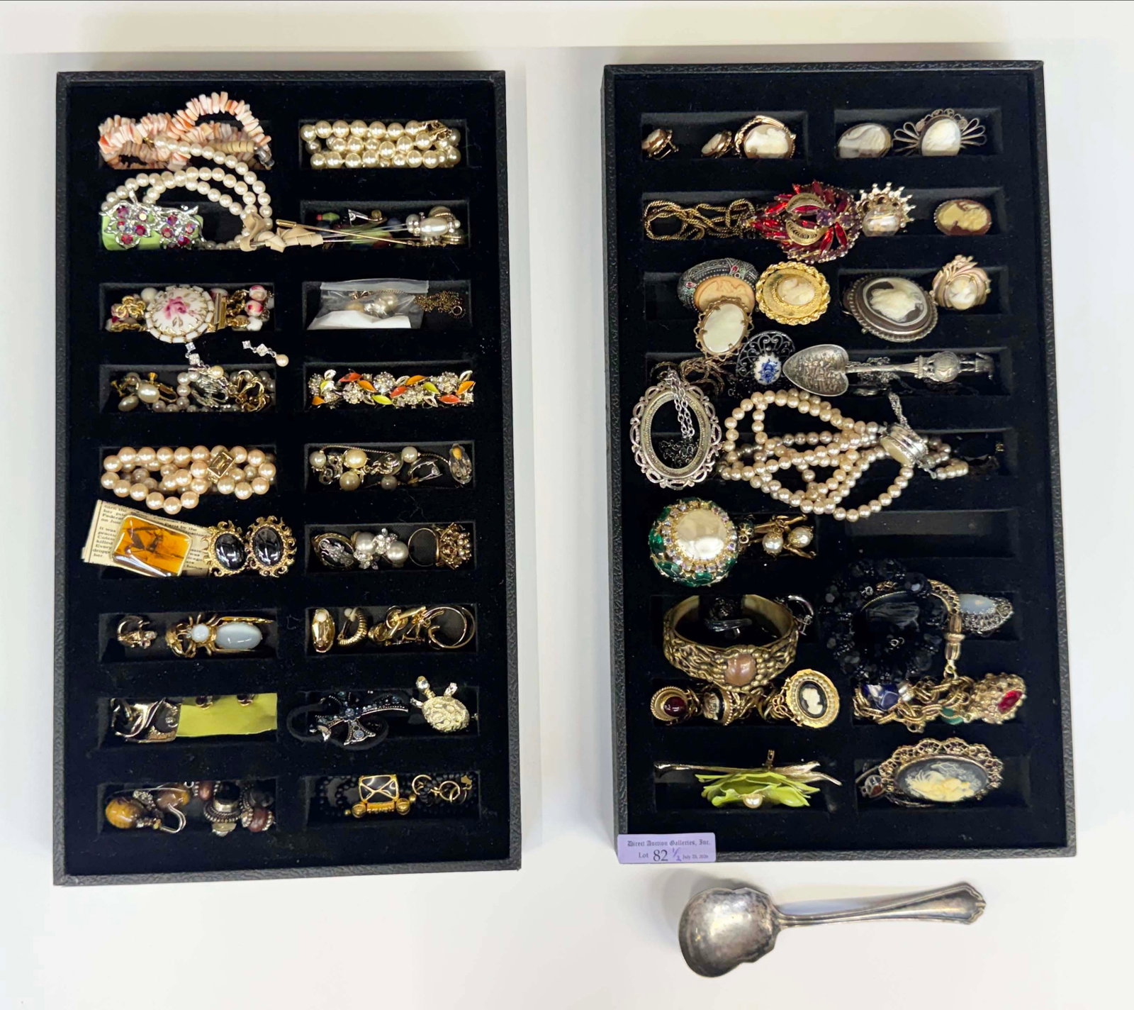 Lot: Costume Jewelry - Antique, Vtg., Cameo, Etc.: The lot contains 74 pieces of jewelry. There are necklaces, earrings, brooches, rings, a watch fob, a pair of cuff links, stick pins, bracelets, charm bracelets, carved cameos, and a couple of spoons.