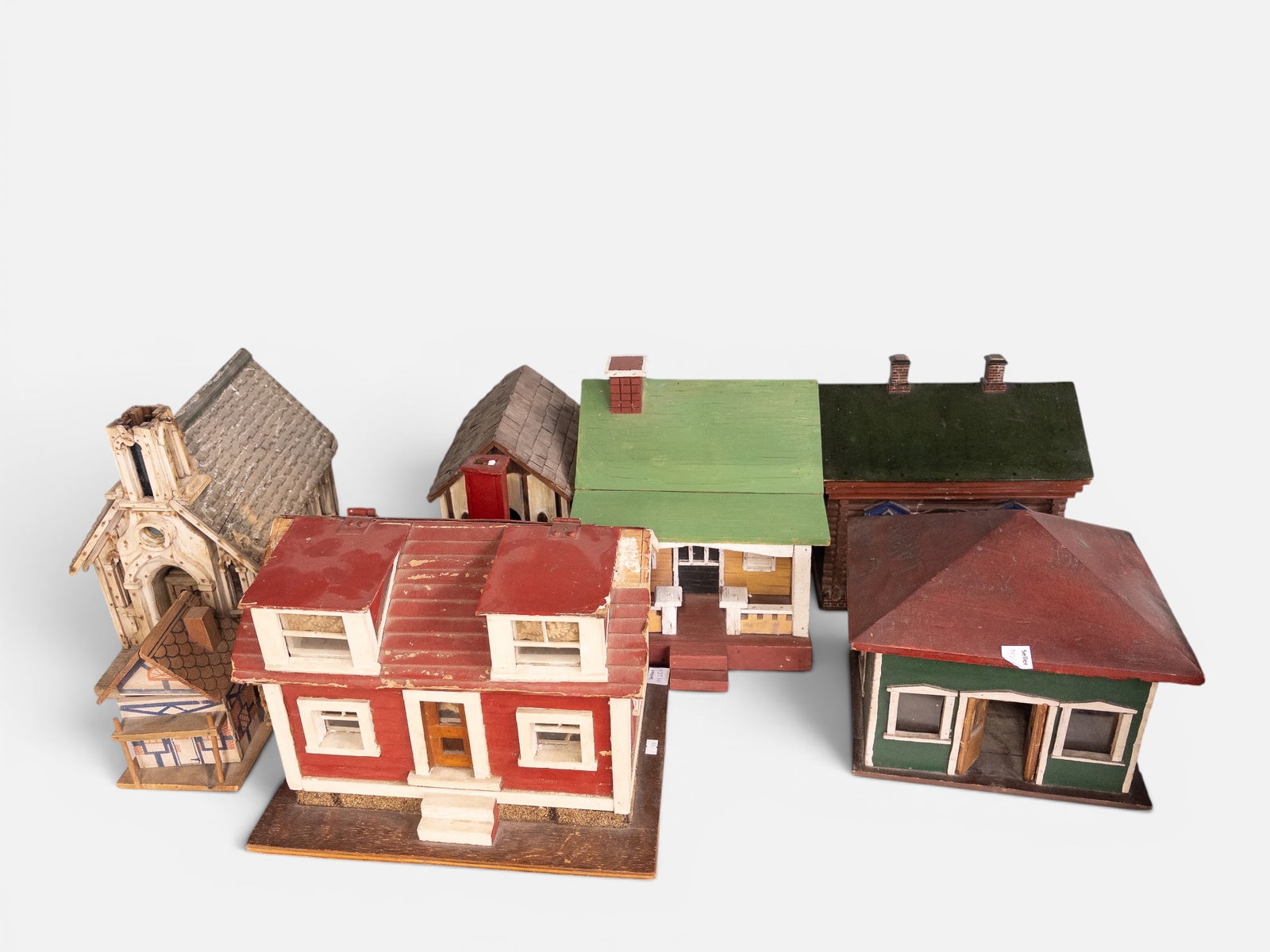 Lot of Folk Art Wooden Painted Model Houses.: Included in this hand built lot are a log cabin with a hinged roof (can be used to store things), a church building, a parsonage, a ranch house, and more. There are some signs of wear, but overall, th
