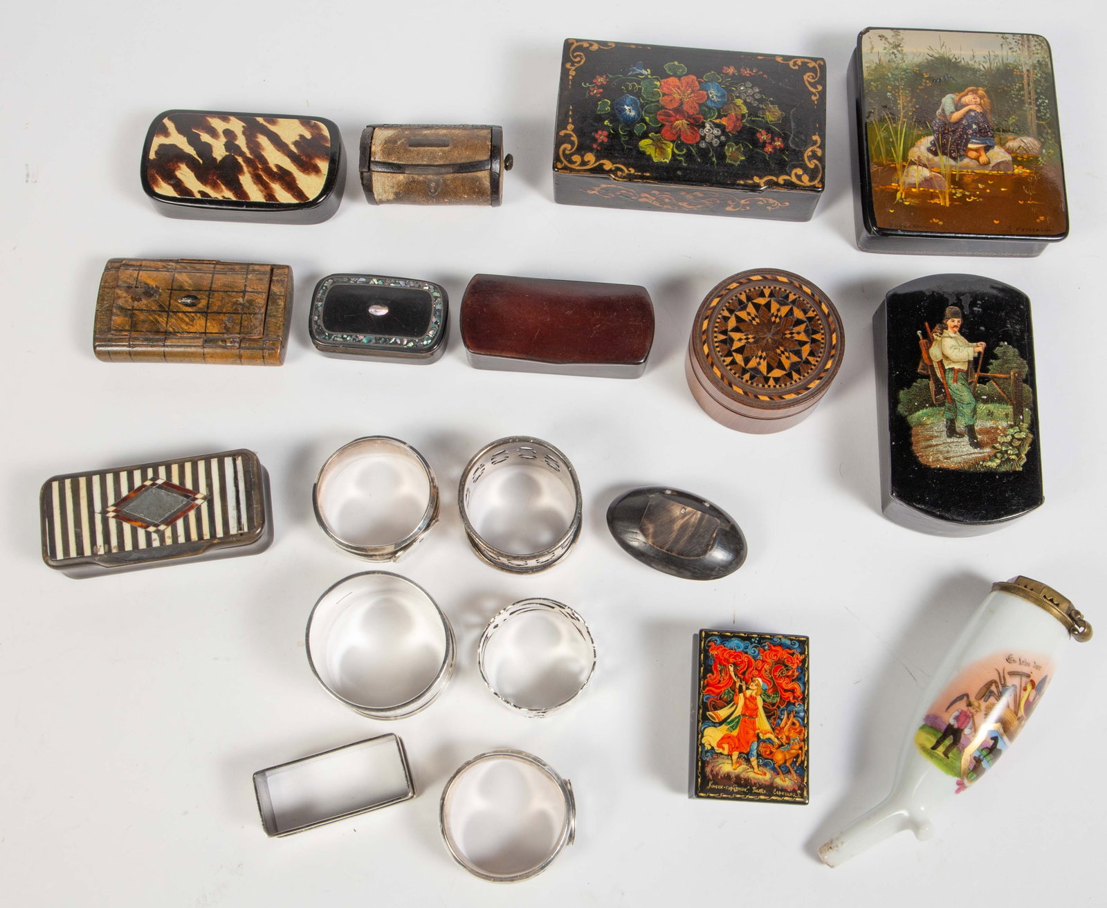 Lot of Trinket & Snuff Boxes, Napkin Rings, etc.: Several of the trinket boxes are hand painted lacquer Russian boxes. They look to be in overall good condition, though one will need its lid reattached. Three of the napkin rings are marked as silver 