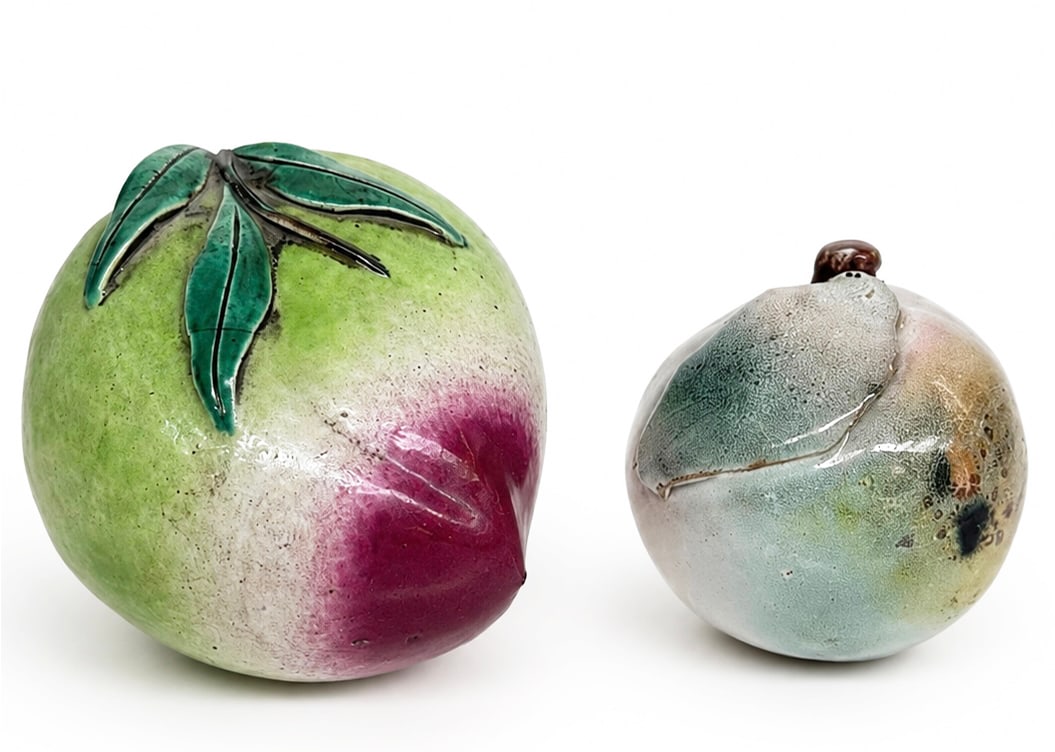 Lot of 2 Antique Chinese Porcelain Fruit.: The peach is glazed porcelain and the orange is glazed clay. the peach has a tiny chip on one of its leaves, otherwise both pieces are in good condition. The peach measures 3" tall, 4 1/4" wide, and