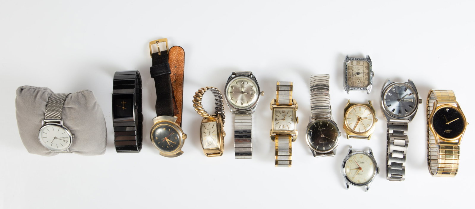 Lot: Vintage Watches - Rado, Bulova, Lord Elgin.: The lot contains 12 wristwatches. There is a ladies' Rado Diastar 205.0296.3 ceramic watch, a Bulova 8-10K gold filled tank watch, a Marshall Field's & Company watch, a Lord Elgin 14K gold filled tank