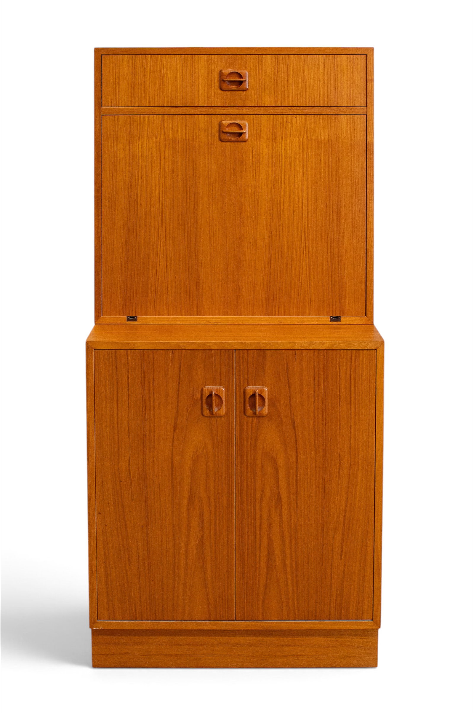 Mid-Century Modern Teak Bar Cabinet.: The top piece has an upper drawer and a drop down door. Inside the door is an adjustable glass shelf and a mirrored back. The bottom piece has a pair of doors with a storage area and a single adjustab