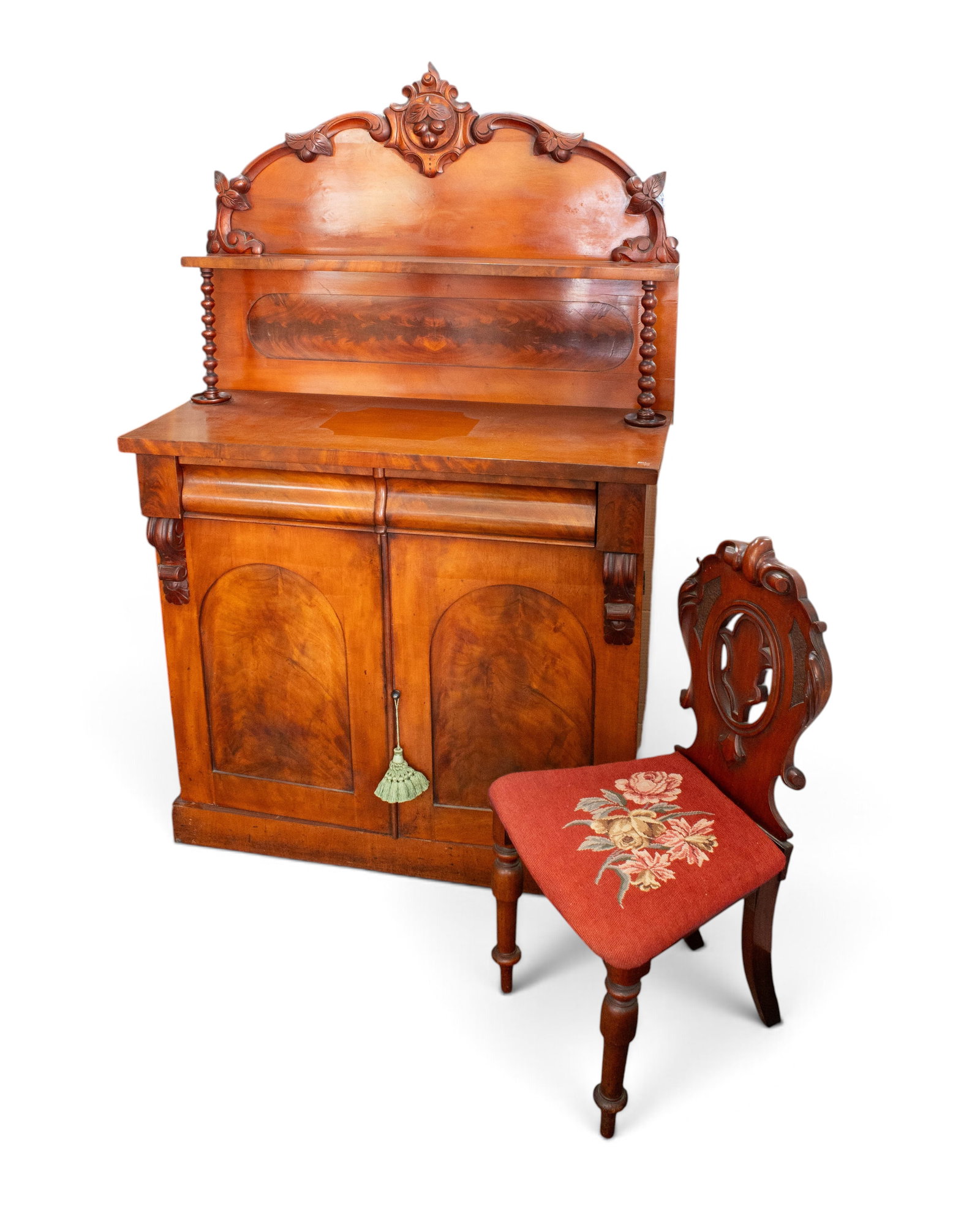 Carved Walnut Victorian Cabinet & Chair.: The cabinet, buffet, or server has two flamed arched panel doors with a removable internal shelf, two drawers, and an upper shelf with bobbin turned supports and a fruit crest. The chair has a scallop