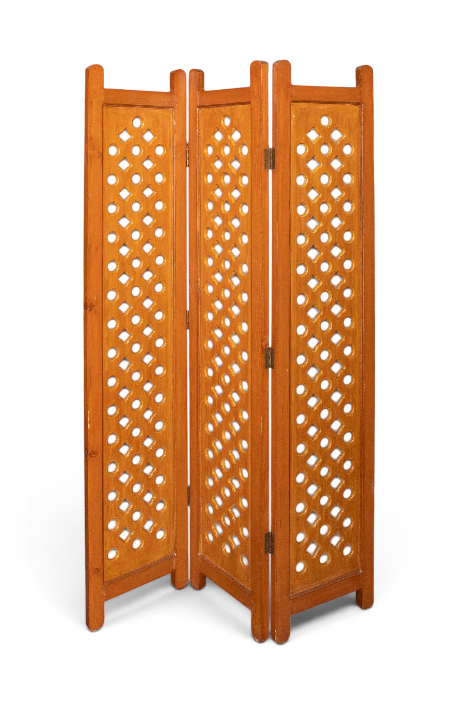 Vintage Reticulated Three-Panel Screen.: This screen has a pierced gemetric design. It is in good condition with some wear. A tag on the top says, "Made in Afghanistan." One of the hinges is loose. Each panel measures 72" tall and 15 1/2" wi