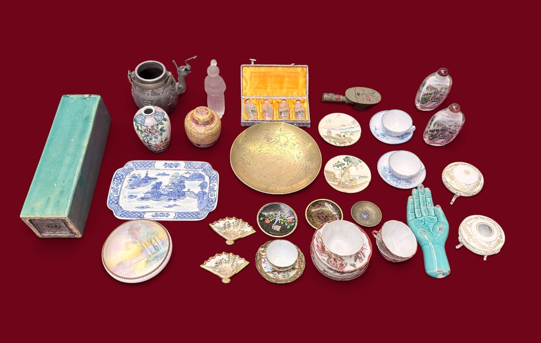 Lot Assorted Asian Objects - Bronze, Snuff, Opium.: The lot contains 35 Japanese and Chinese items. There are tea cups, saucers, snuff bottles, sculptures, ashtrays, a tea pot, vases, a ginger jar, and more. Some of the stand out items are a green glaz