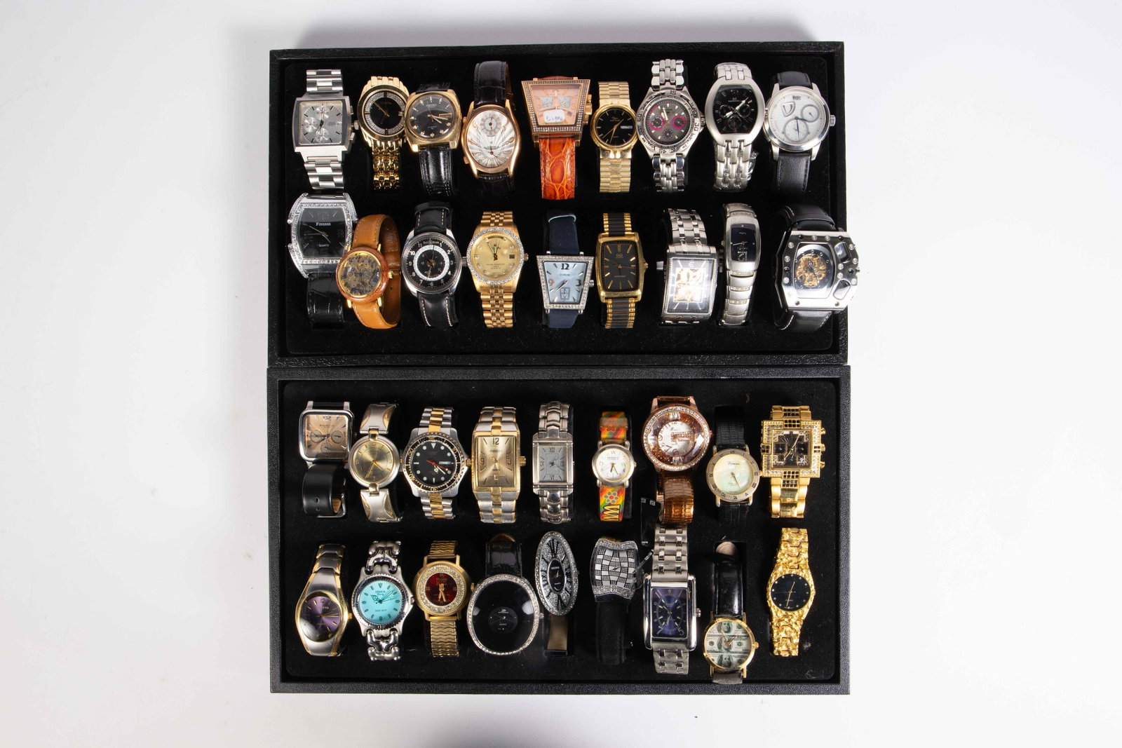 36 Mostly Quartz Wristwatches - Geneva, Rauan.: The lot includes Finesse, Bell & Ross (As Is, missing its center), Elgin, Corum (Likely an Imitation), Q&WQ, Acid, Carles Delon, Wohler, Calvin Hill, Fossil Blue, Oscar de la Renta, Techno Master with