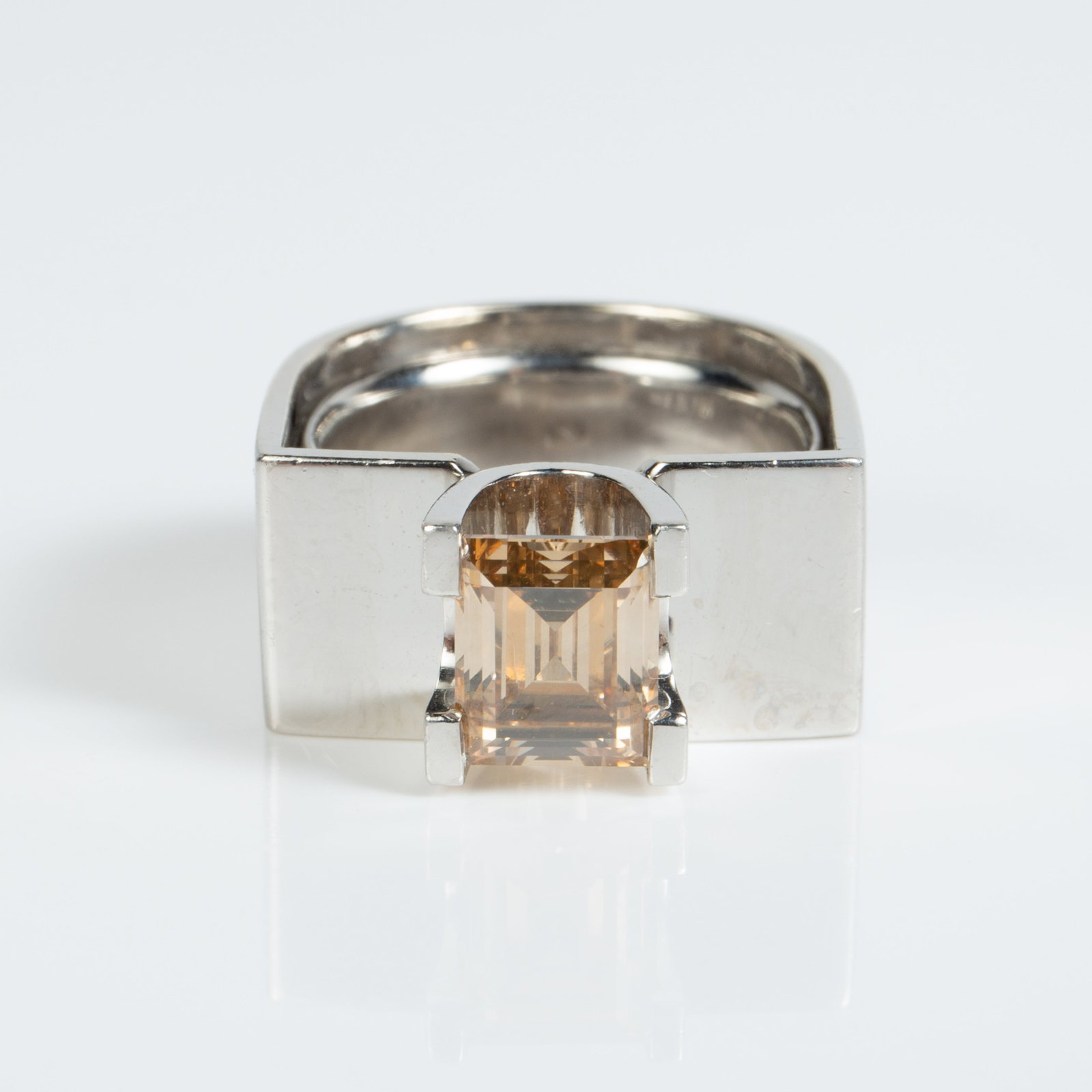Kunz Platinum & 0.73 Ct. Solitaire Diamond Ring.: The modernist style ring by German goldsmith Robert Kunz is marked Kunz / RK / Pt. 950 inside the band. The piece comes with the original purchase certificate from 1990, which states that the ring is