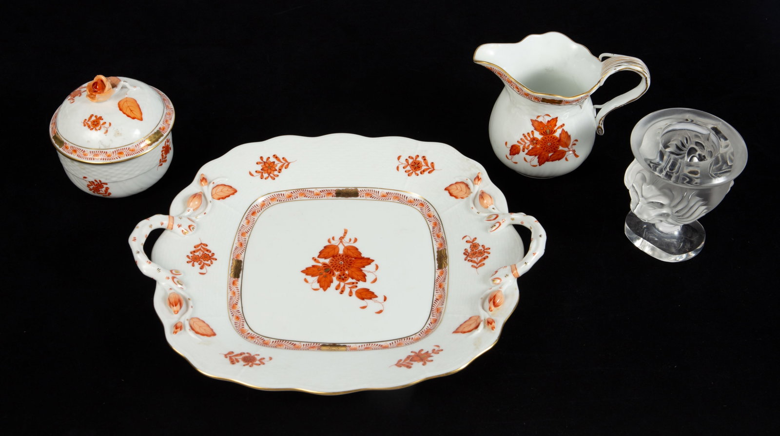 Lot: Herend Chinese Bouquet Dishes, Lalique Lion.: The Lalique frosted crystal lion can holds matches or cigarettes. The three Herend "Chinese Bouquet" rust-colored dishes are a creamer jug, a jar with a rose lid, and a two-handled tray. Overall, the 