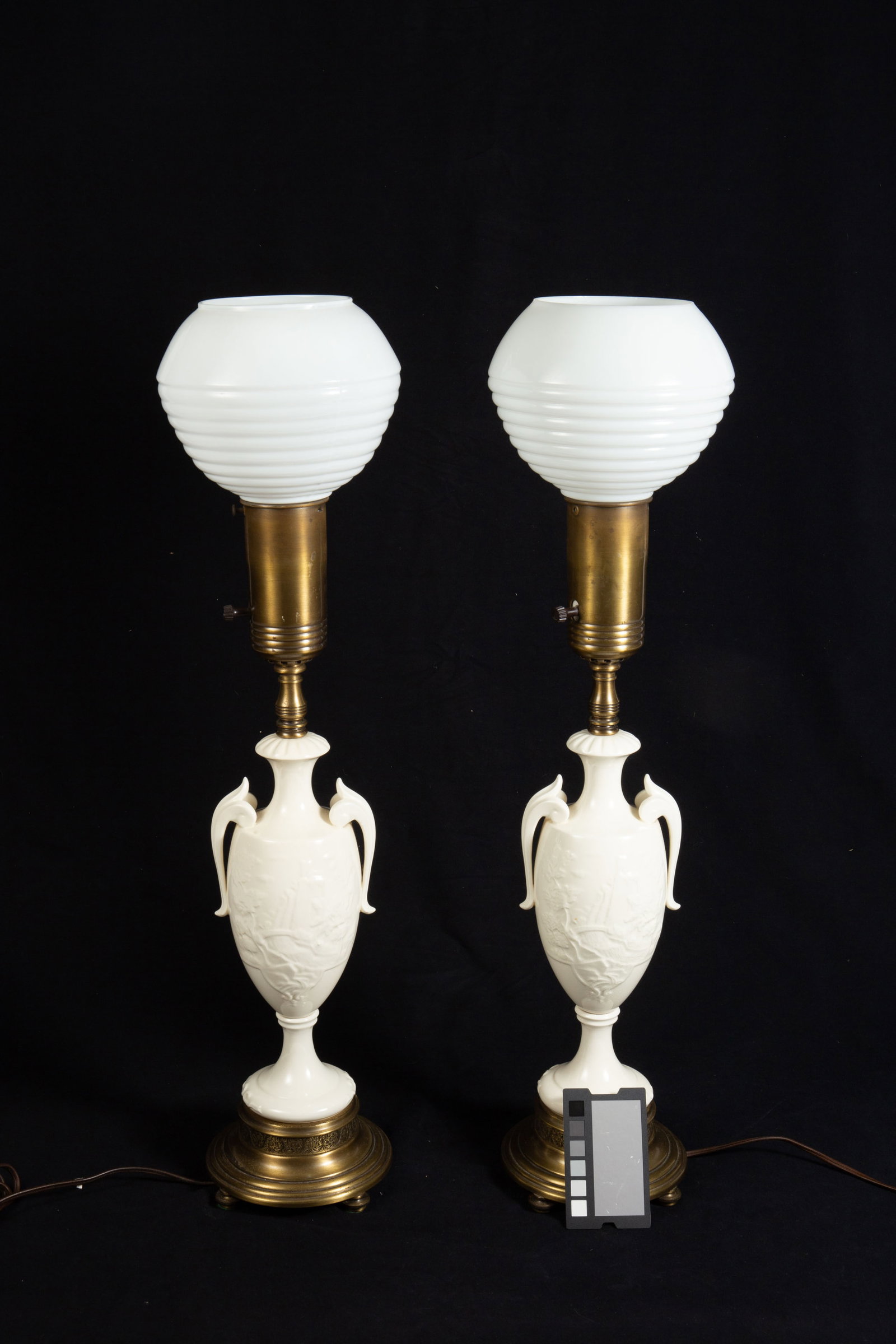 Pair of White Porcelain Vase Lamps.: There is some crazing present. Each lamp measures approximately 6 3/4" x 6 3/4" x 28". In-house shipping is available. To receive the best shipping rate on this item, please check the "Self Arranged" 