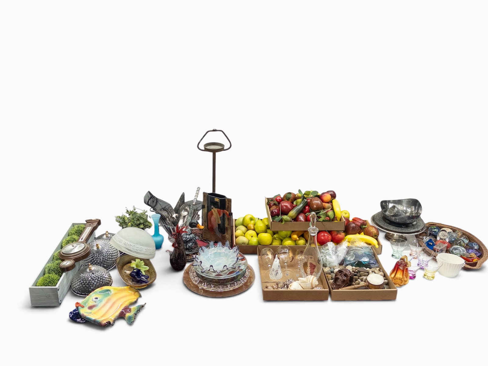 Huge Lot: Faux Fruit, Stones, Ash Stand, Art Glass: The lot contains over 100 items. There is art glass, a carved stone pumpkin, a vintage barometer, sea shells, a tray of smooth stones, a small bag of red glass gems, and a small bag of clear square