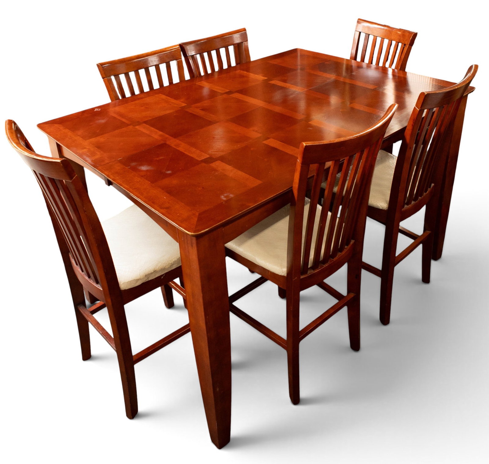 Counter Height Expandable Dining Table w/ 6 Chairs: The solid wood dining set has a tessellated top composed of two shades of wood, rounded corners, tapered curved legs, and matching chairs or counter stools with slatted backs. The table comes with an