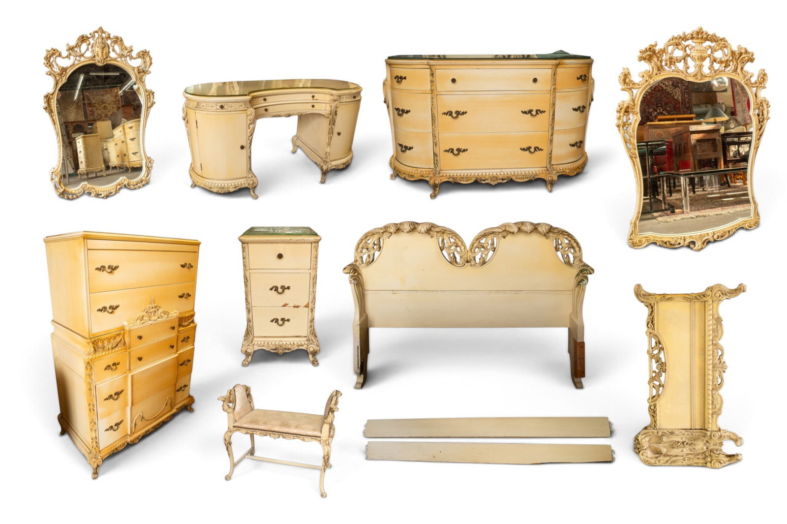 Carved Beige French Provincial 8-Piece Bedroom Set: The ornate bedroom set includes an 8-drawer highboy dresser, a kneehole vanity with drawers, doors, a mirror and bench, a 9-drawer dresser with a mirror, a 3-drawer side table or nightstand, and a