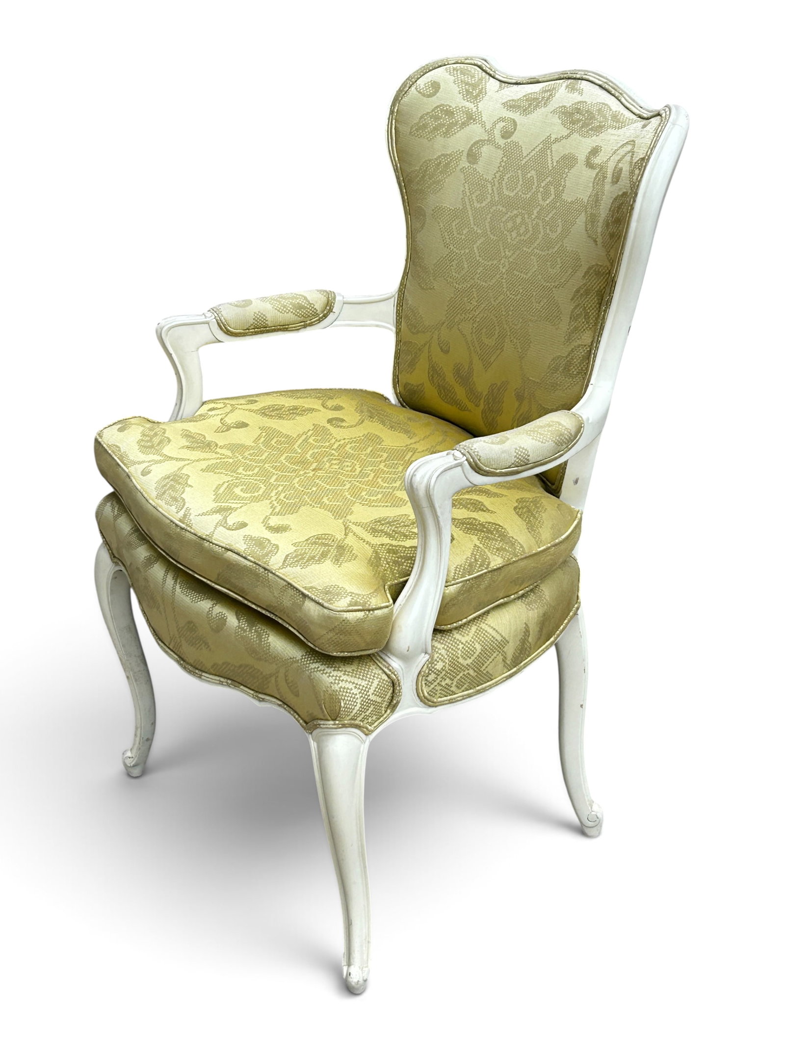 French Provincial Louis XV Style Armchair.: The minimally carved armchair has scroll decorations on the feet and arms. The wood is painted in an off-white color, and the upholstery is a yellow floral silk-like material. The custom seat cushion 