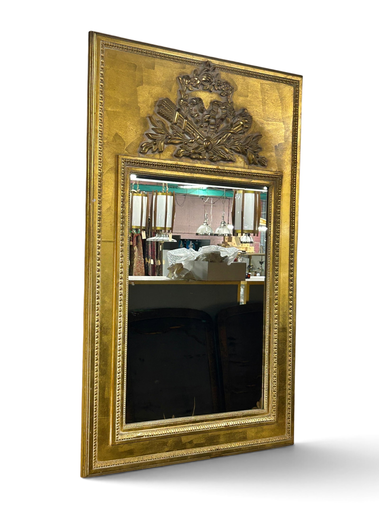French Antique Gilded Mirror w/ Pediment.: The mirror has a double frame with a carved border, and a classical ornate pediment with a bow, torch, flowers, and other elements. The piece measures 50" tall and 32" wide. There are some scratches a
