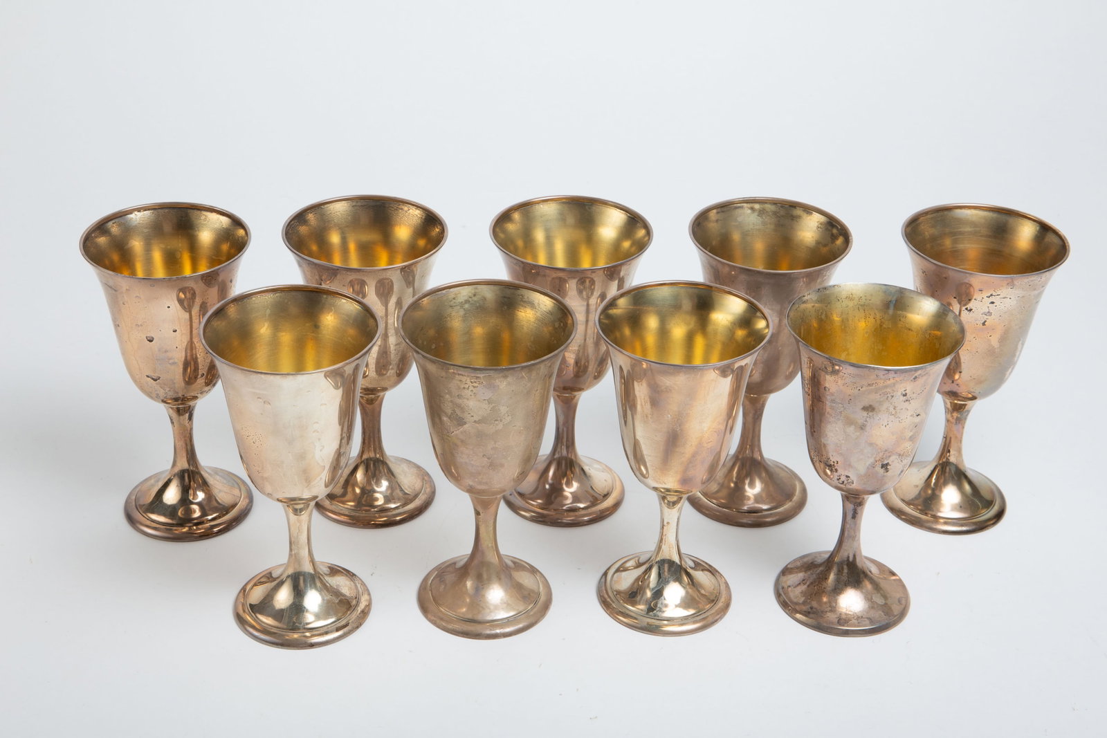 Set of 9 Alvin Sterling Silver Wine Goblets.: They look to be in overall nice condition, with some tarnish present. They have a total weight of 44.1 Troy Ounces. Each goblet measures approximately 3 3/8" x 3 3/8" x 6 5/8". In-house shipping is