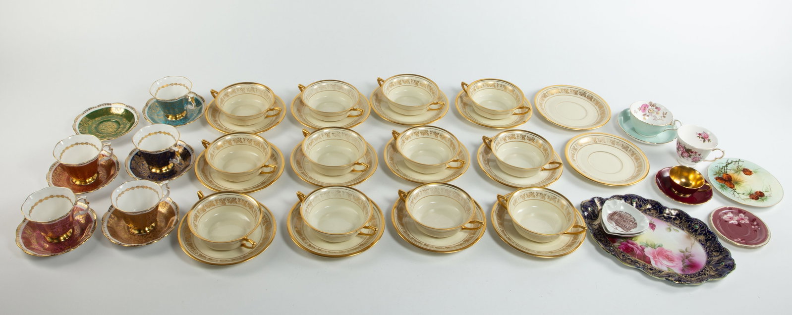 Lot: Bavarian Cream Soup Set, Royal Albert, etc.: This lot includes a 26-piece Bavarian soup bowl and underplate set (a few chips), 5 Royal Albert "Buckingham Series" teacups with matching saucers, an elaborately decorated Nippon tray with flowers,