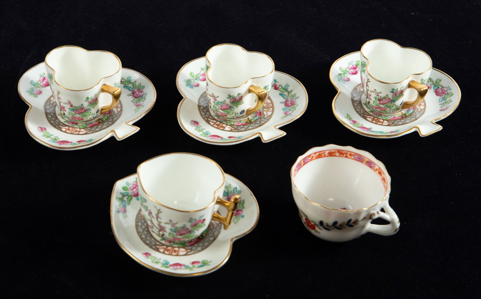 Coalport "Indian Tree" Demitasse Set, Meissen Cup.: This lot includes three Coalport "Indian Tree" club-shaped demitasse cups with saucers, a Coalport heart-shaped demitasse cup and saucer in the same pattern, and a Meissen Asian-inspired demitasse cup