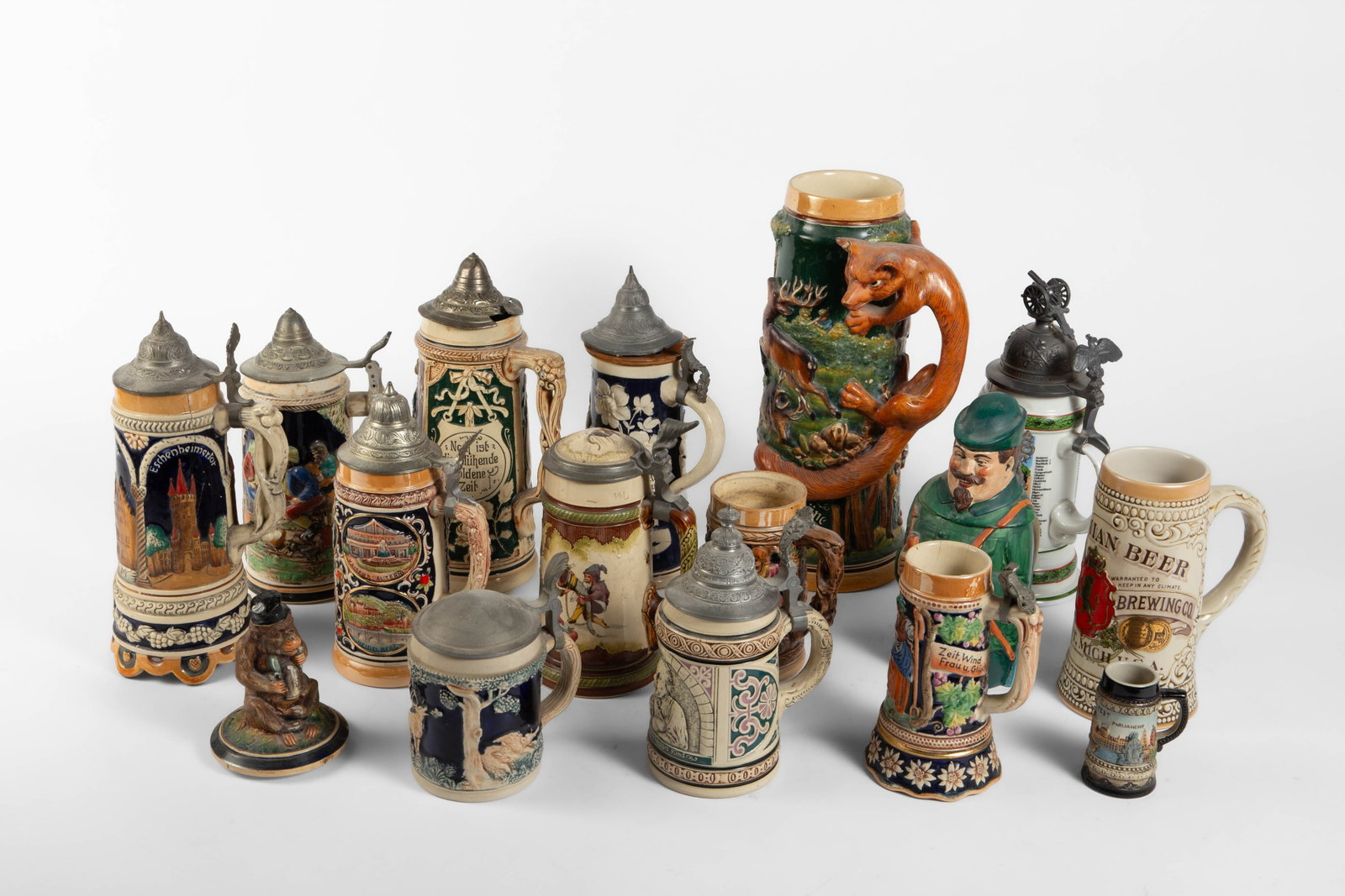 Lot of Assorted Vintage Steins.: Some are As Is, with missing lids or a small crack. The lot could use a cleaning. The largest item in the lot measures 6 5/8" x 5 5/8" x 13 3/8". The smallest item measures 2 3/4" x 2" x 3 1/2". In-ho