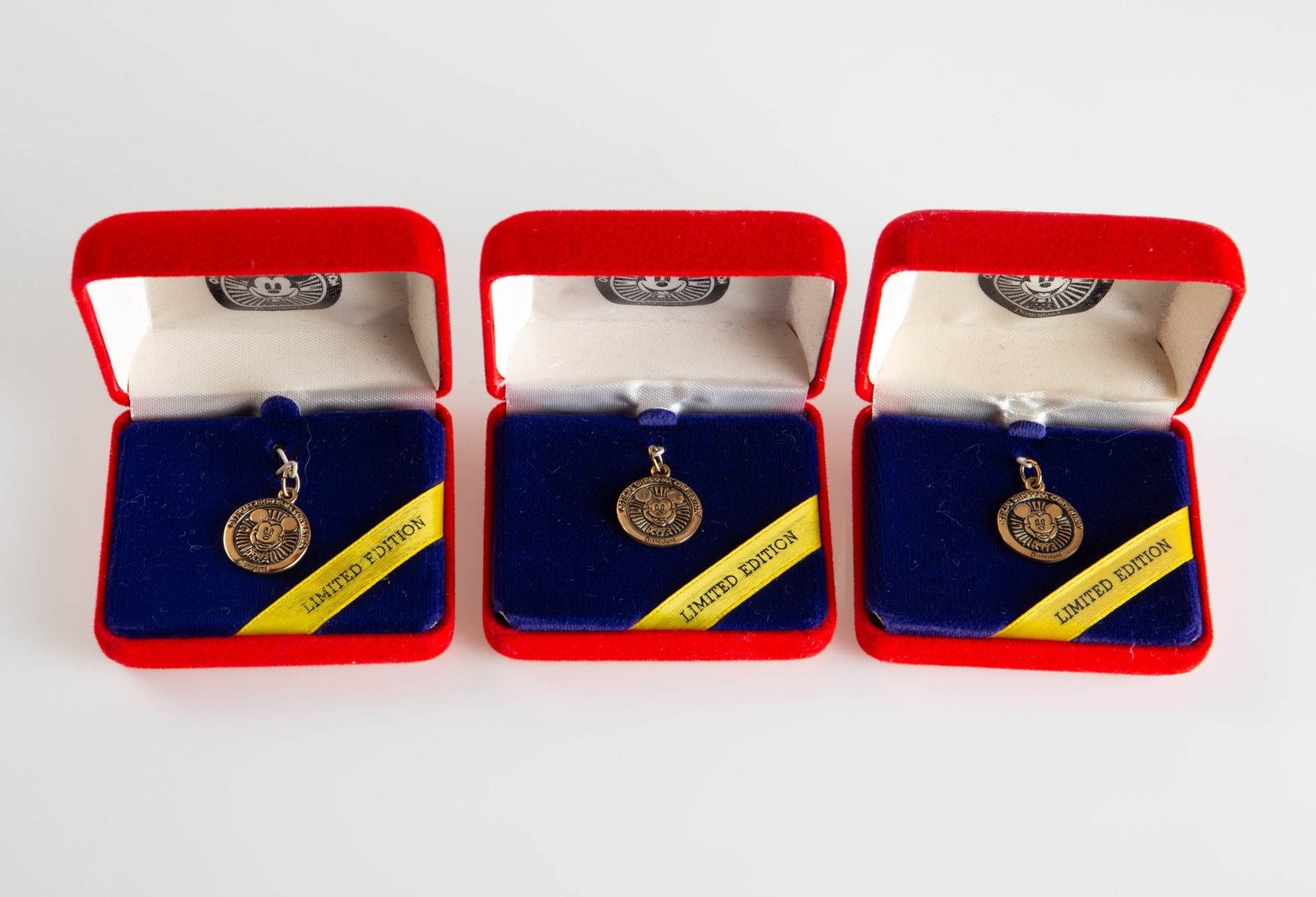 Three 14K Gold 1993 Disney Convention Charms.: The lot contains three 1993 Official Disneyana Convention Mickey Mouse charms. They are all marked Commemorative Edition Limited to 500 / 14K / Disney on the backs. They measure 16mm in diameter, and 
