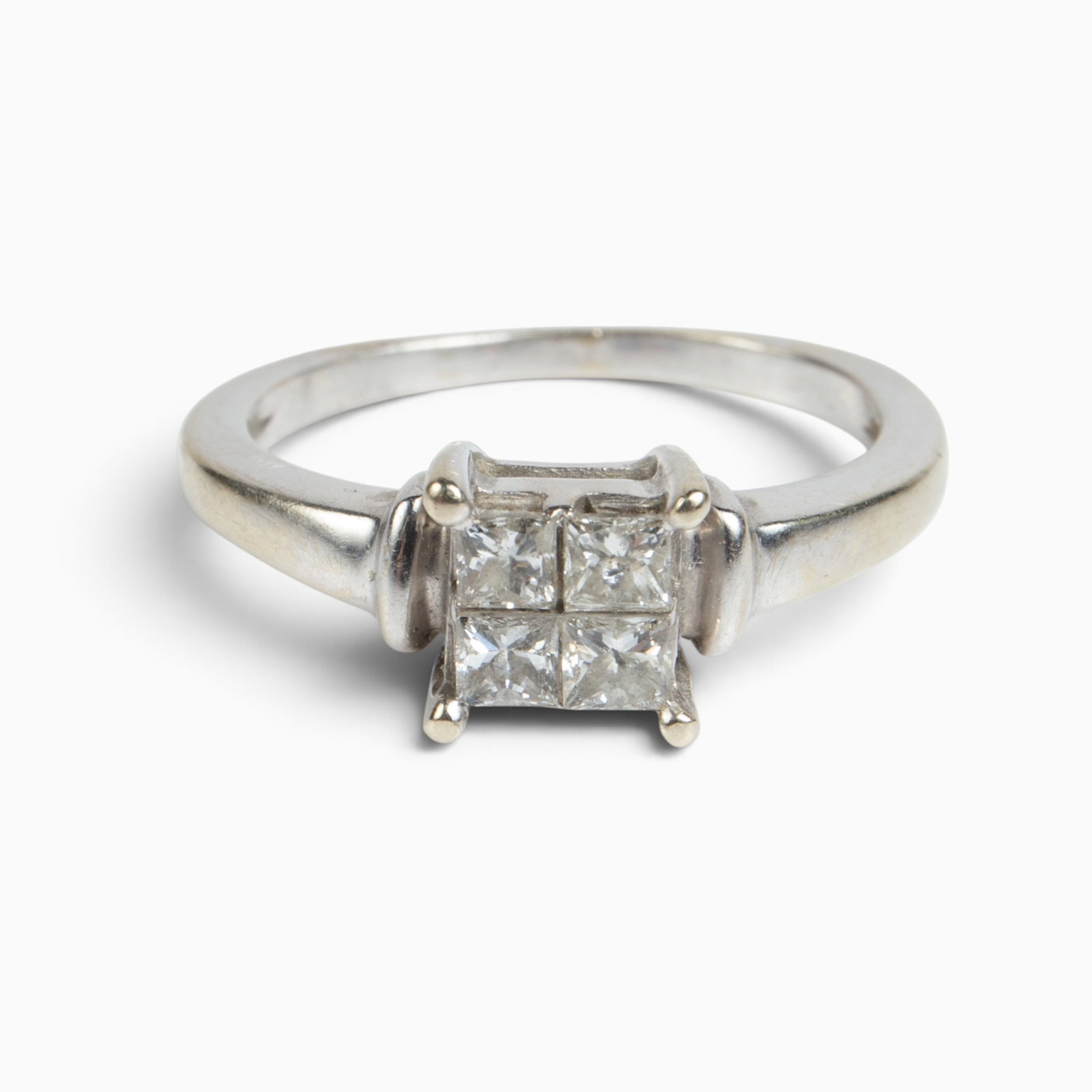 14K White Gold Quad Solitaire Diamond Ring.: The engagement ring is unmarked but tested appropriately for 14K gold. It features a central princess cut style solitaire quad diamond (4 square diamond cluster) which measures as a whole 5mm x 5mm. T