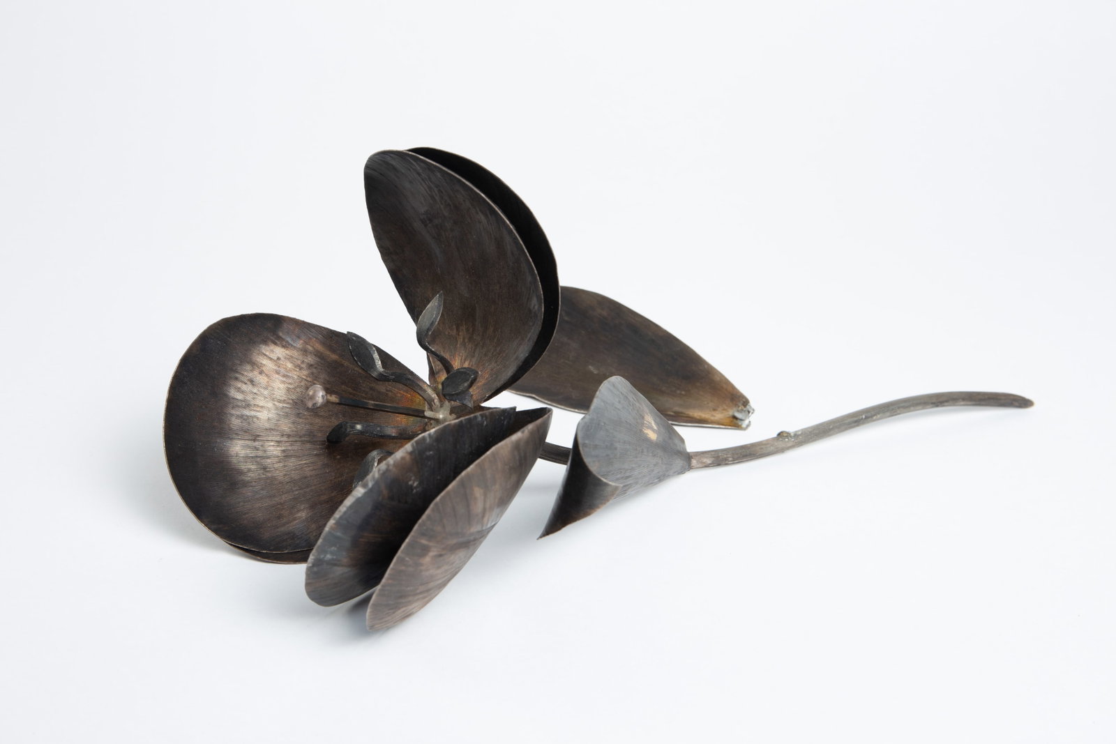 Sterling Silver 3D Flower by Alfredo Villasana: The flower is marked 925 / TAXCO / Mexico / Sterling / "Villasana" on the underside of the disconnected leaf's tip. The flower has 6 petals, two leaves, a stamen, and a pollen tube. It measures 12 3/4