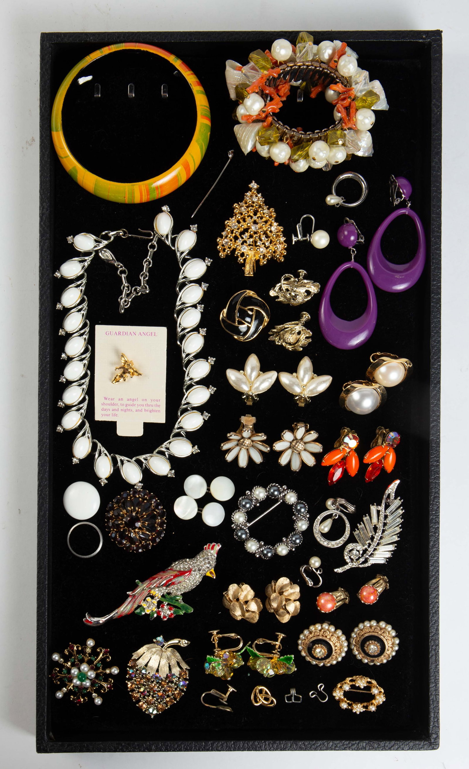 Lot: Platinum Ring & Costume Jewelry.: The lot contains 24 pieces of jewelry, including a platinum band. The band is a size 6 1/2, and weighs 1.4 Pennyweight, or 1.9 Grams. There are bracelets, a necklace, a button, earrings, and brooches.