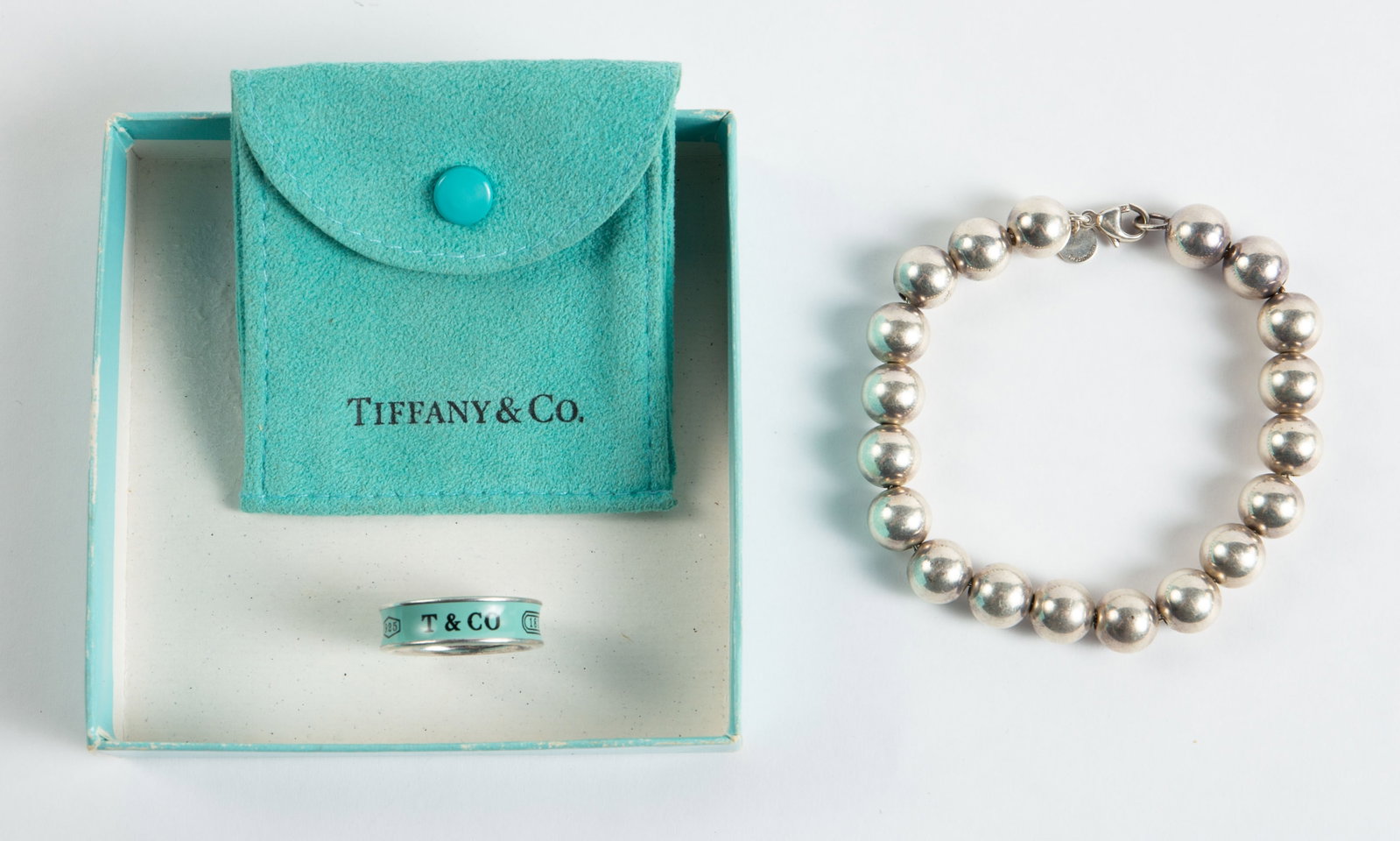 Tiffany & Co. Sterling Bead Bracelet & Enamel Ring: The ring is enameled in Tiffany blue and marked 925 / T & Co. / 1837 over the enamel. It is also marked T & Co. / 925 / Germany on the inside. It is size 9 1/4, and measures 1/4" from top to bottom. I