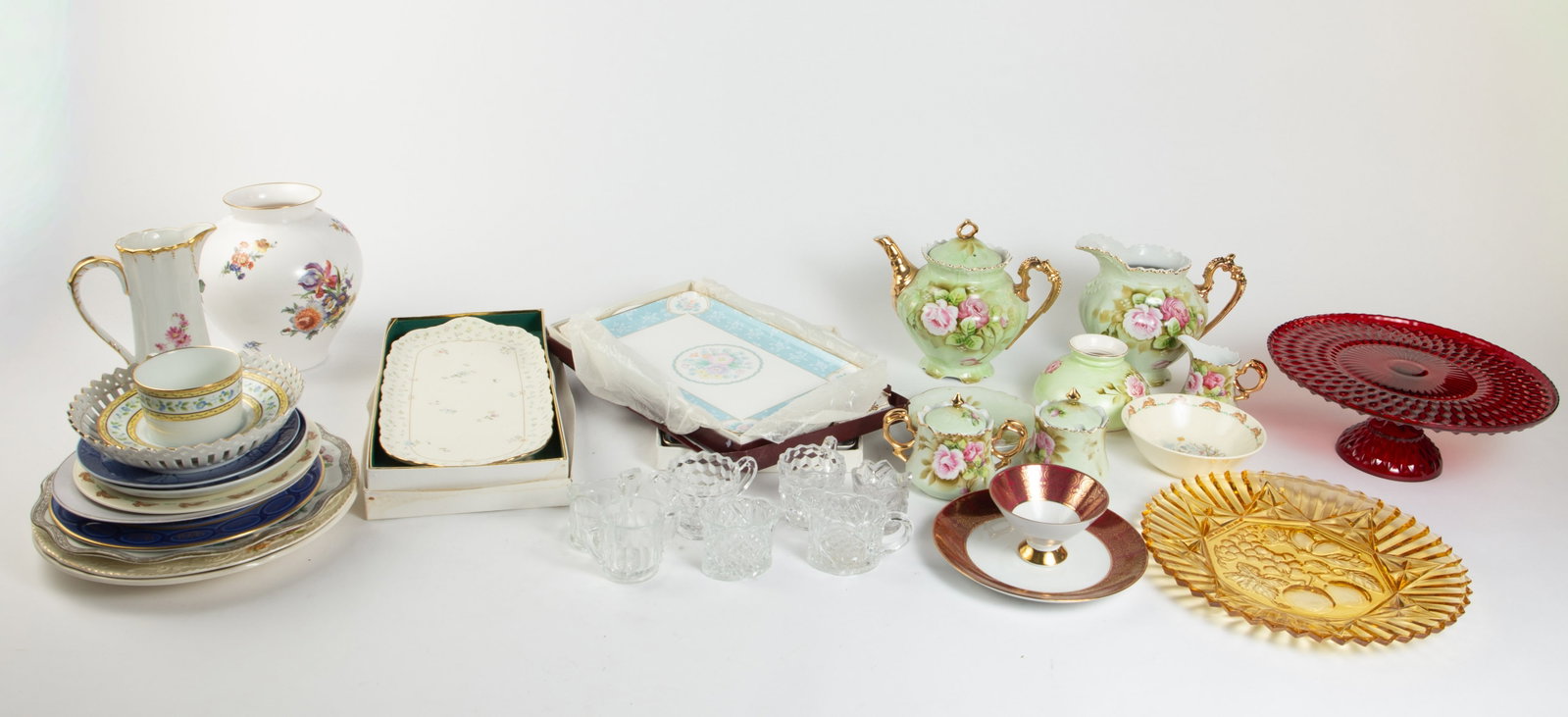 Lot: Royal Doulton Bunnykins, Dresden, Lefton, etc: Overall, the lot looks to be in good condition. The green tea set is Lefton. The flower pitcher is marked, "Dresden". There are also a few Royal Doulton "Bunnykins" pieces, platters by Sango and Narum