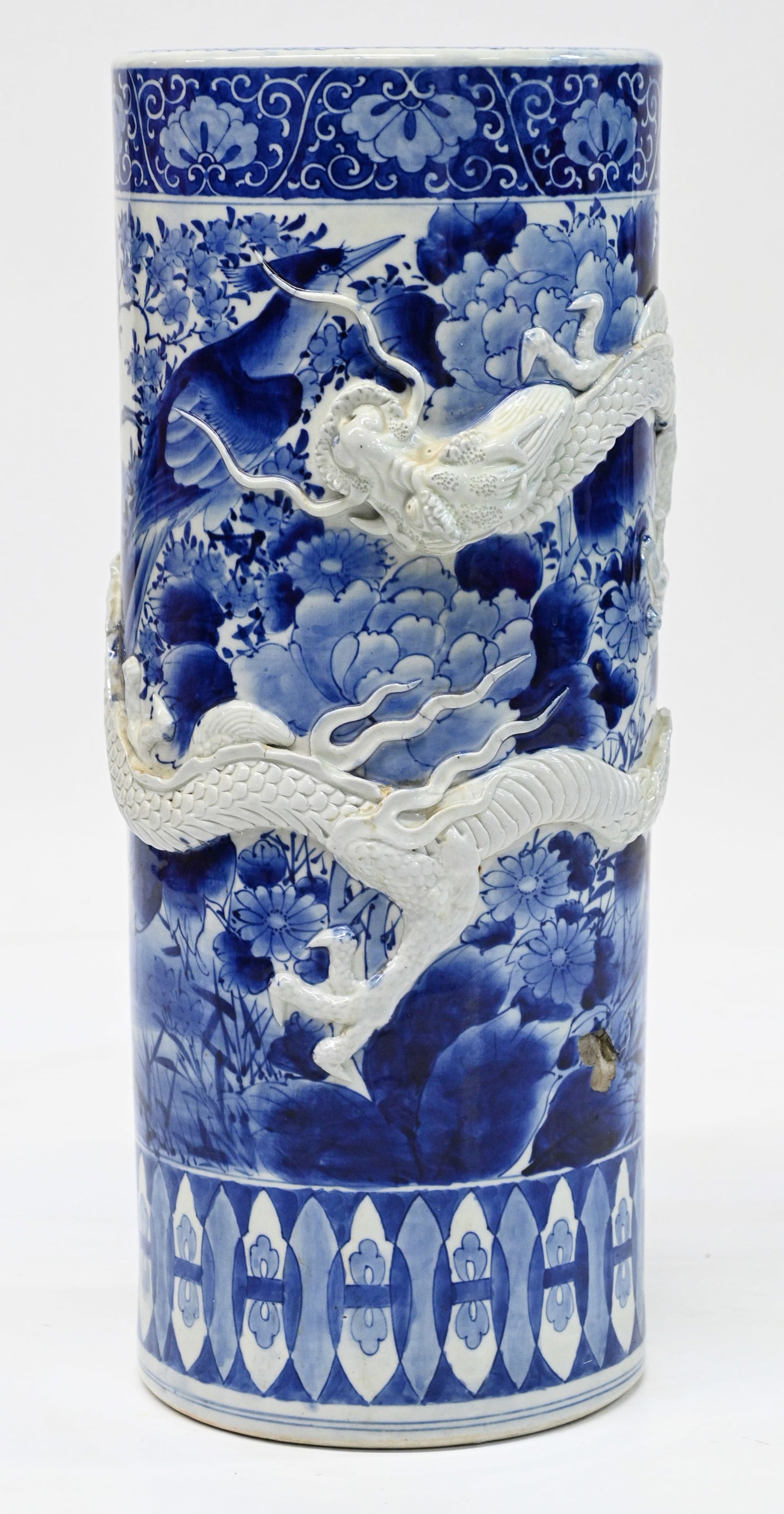 Japanese Meiji Period Dragon Vase / Umbrella Stand: With a Raised Relief Porcelain Dragon Running around the Side of the Vase. The Vase has some Age Cracks in the Bottom, and a 1 1/4" x 1" Chunk Missing on the Side, with a Small Crack in that Area as W