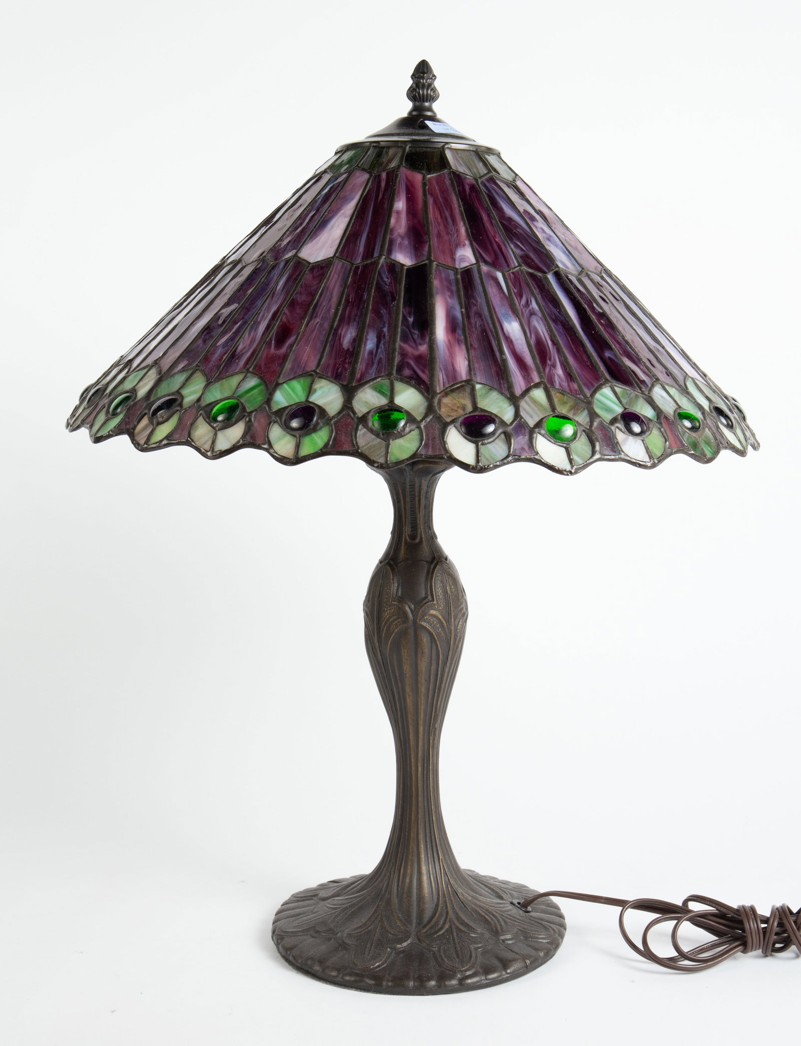 Peacock Style Contemporary Leaded Table Lamp.: The purple and green shade has round jewels near the lower edge. The cast metal base does not attract a magnet. The 3-light lamp measures 21" tall, and up to 17" in diameter. There are some scratches