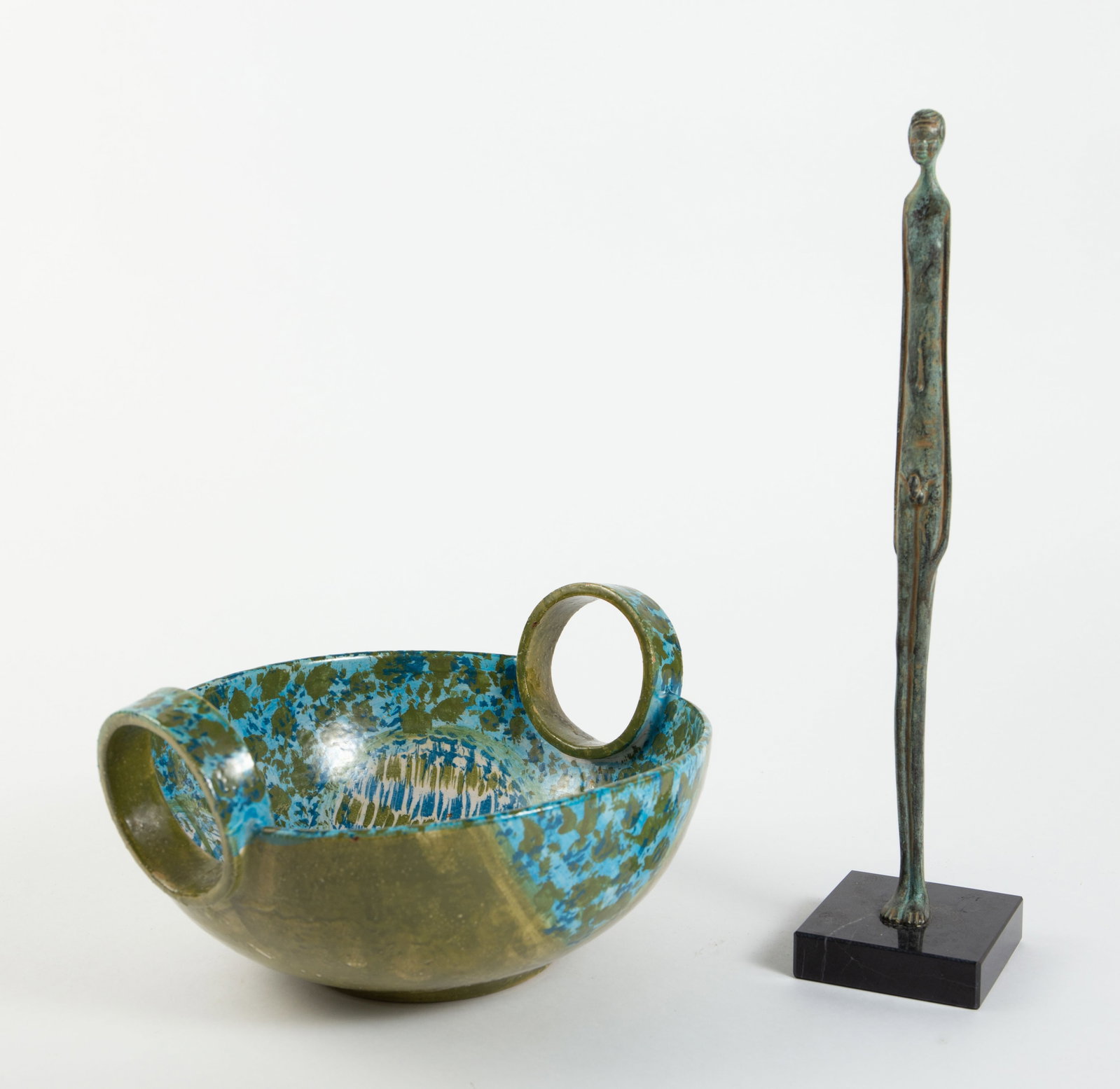 Lot: Bitossi? Raymor Bowl, Bronze Nude of Man.: This Italian pottery bowl with round handles looks to be in nice condition. It measures 11" x 9 5/8" x 5 3/4". The bronze statuette is a replica of the Etruscan "Shadow of the Night" or "Shadow of the