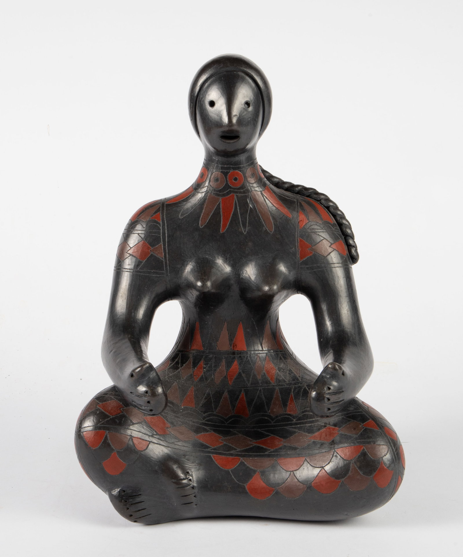 Seated Woman Sculpture, Attr. to Manuel Felguerez.: There does not appear to be a signature. It is a polychrome pottery woman with a single thick hair braid. Overall, it looks to be in good condition. The measurements are 10" x 7" x 14 1/4". In-house