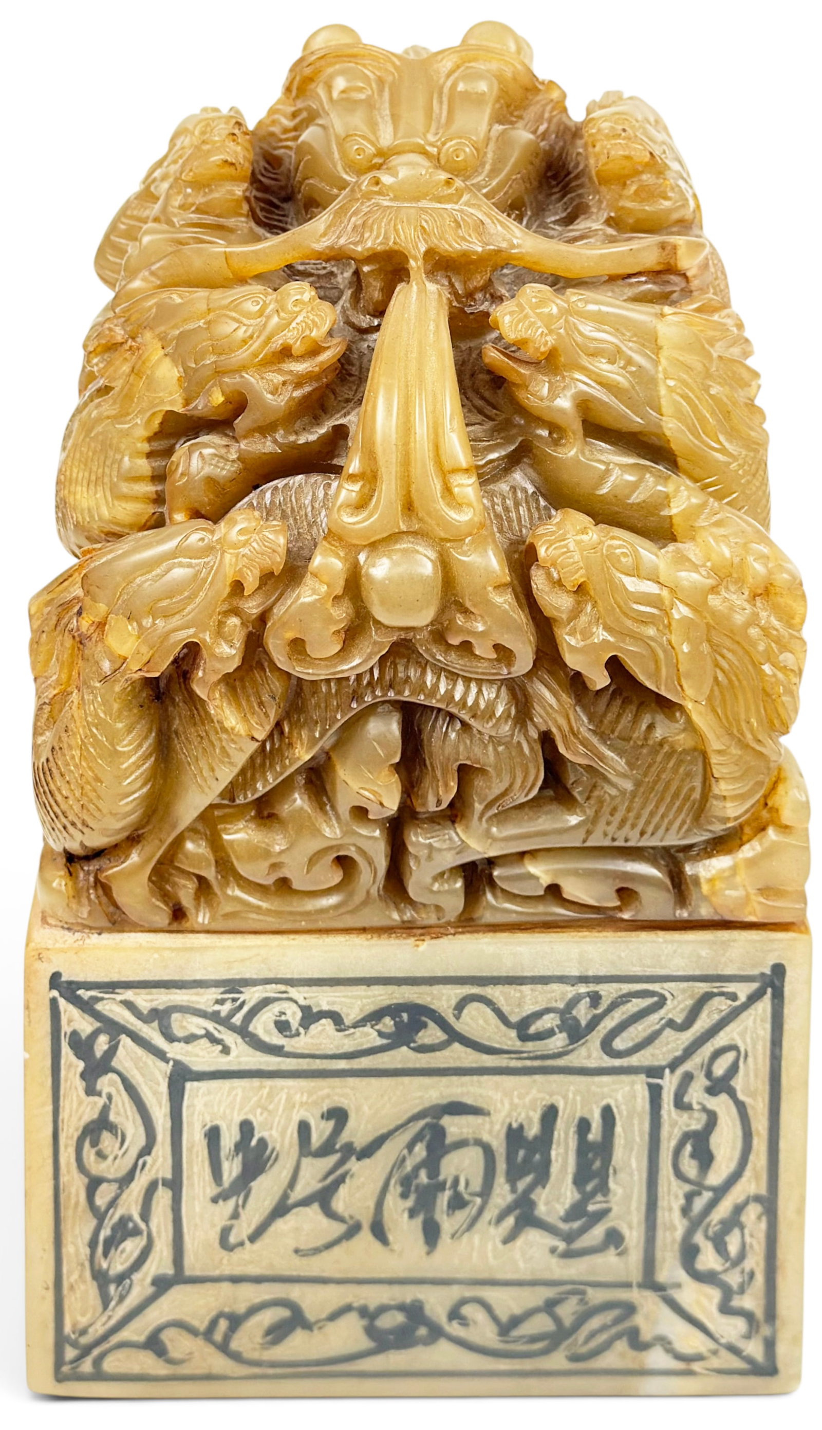 Oversized Chinese Carved Soapstone Dragon Seal.: The heavy intricately carved soapstone seal features many dragons. It measures 10 1/2" tall, 6" wide, and 6" deep. There are some age cracks on the piece, and some chips on the left side of the carvin