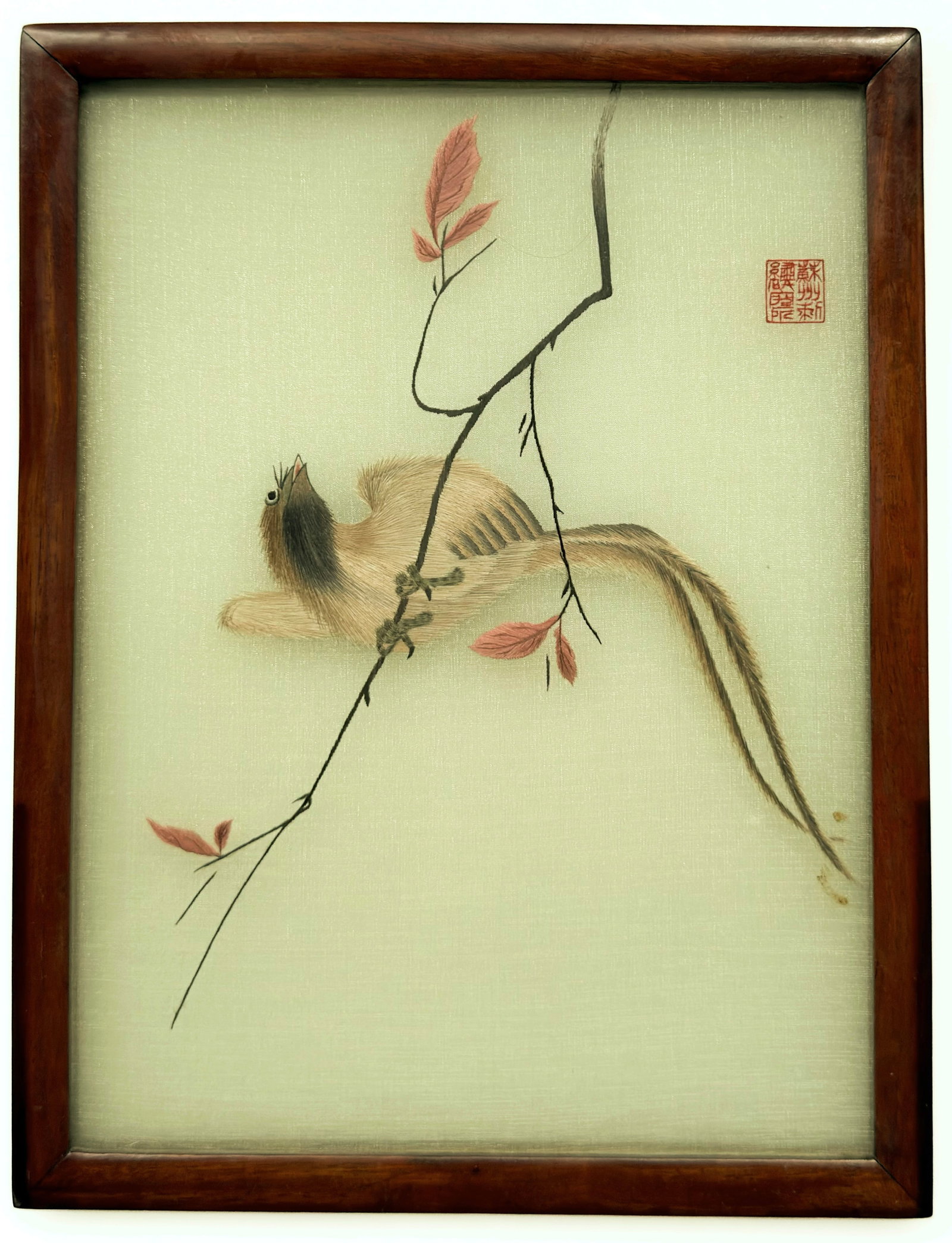 Vintage Chinese Framed Silk Embroidery of a Bird.: The delicate art piece features a long-tailed bird perched on a branch with mauve pink leaves. It has a red factory seal on the top right. The 1/2" thick frame measures 10 1/2" x 8". The piece is in