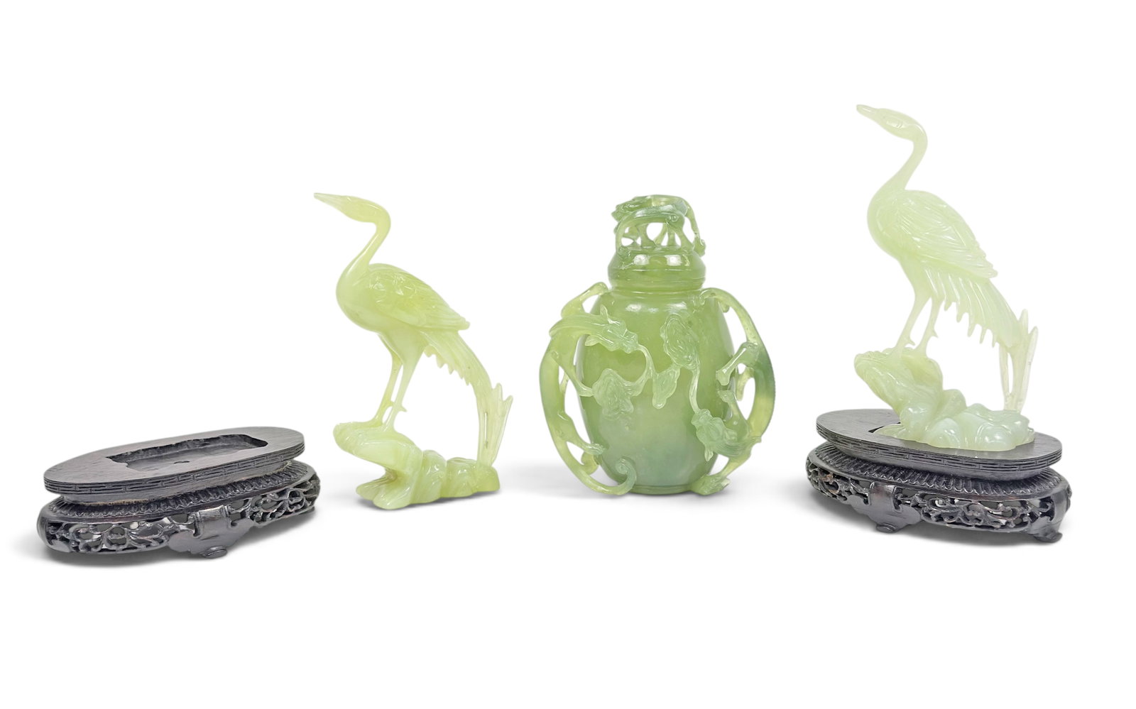3 Pcs. Chinese Jade Items - Cranes & Jar.: The lot contains 3 carved jade items. There are 2 matching crane bird sculptures with carved wood stands, and a lidded jar with openwork dragon figures. When on the stands, the cranes measure 8" tall.