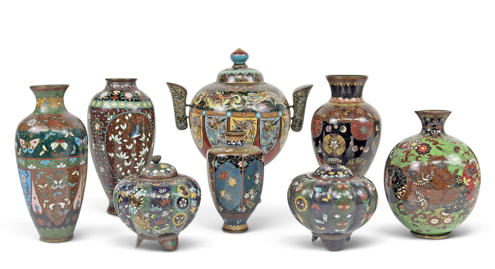 Lot of 8 Antique Japanese Cloisonne Items.: The lot contains 5 vases, a double-handle urn, and 2 pumpkin-shaped lidded jars. The urn features intricate dragon and bird designs, and the rest of the items feature flowers and a few birds. Some of 