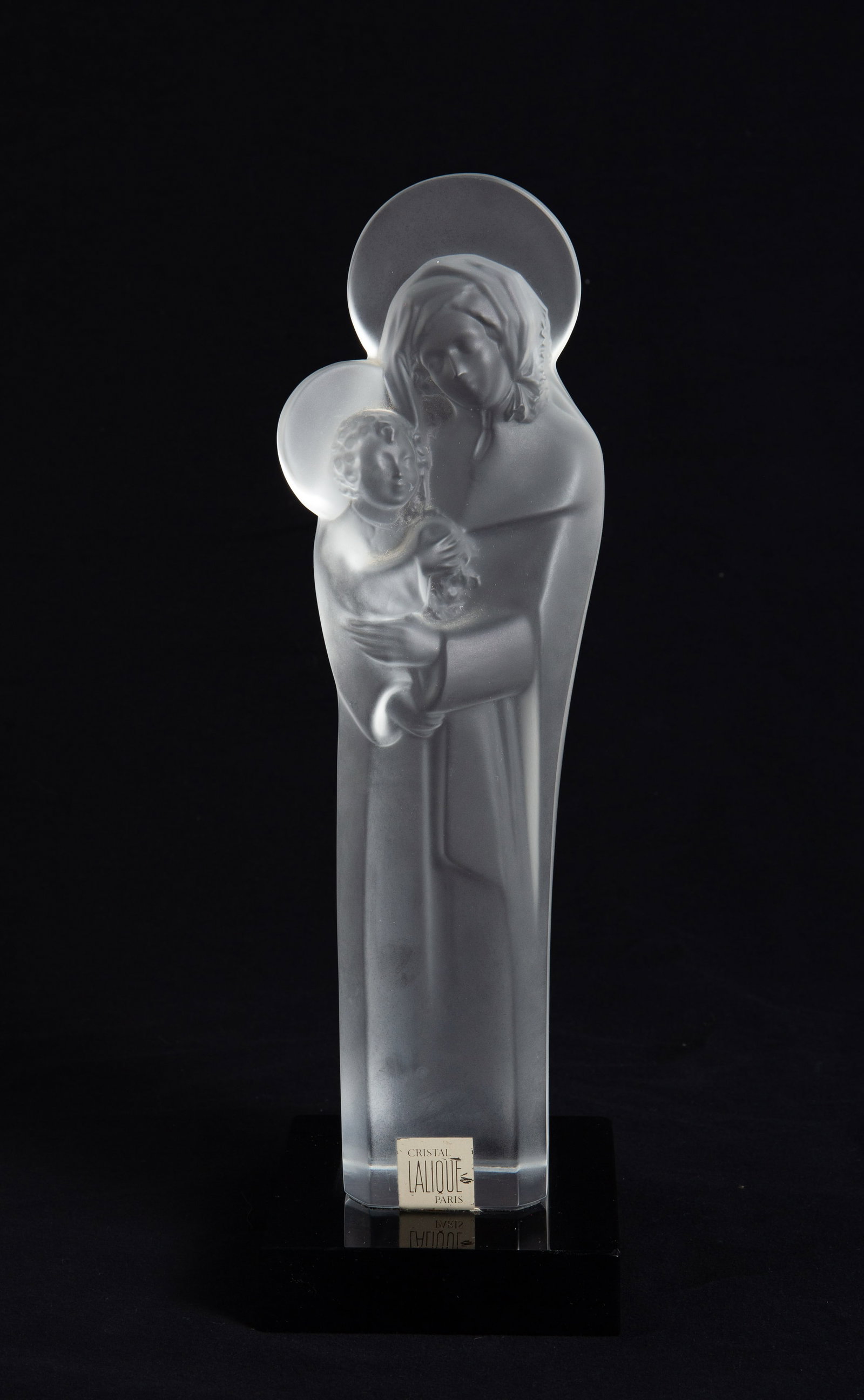 Lalique Frosted Crystal Madonna and Child Figure.: It looks to be in nice cosmetic condition. The figure is attached to the black base. The dimensions are 4 3/4" x 4 3/4" x 14 5/8". In-house shipping is available. To receive the best shipping rate on