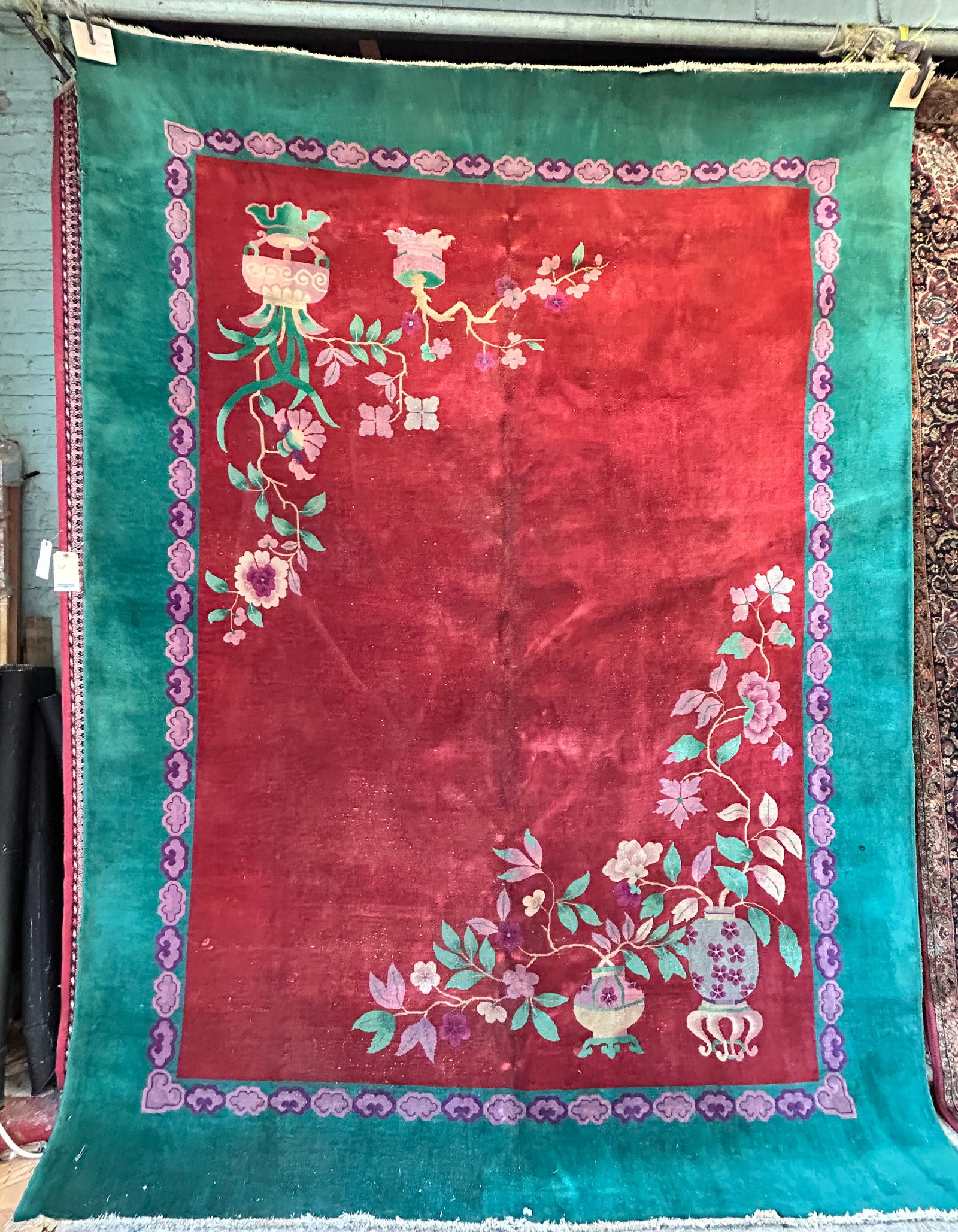 8' 8" x 11' 5" Art Deco Chinese Rug.: The rug has some tiny moth damage divots along the sides (barely noticeable), and a little wear to the sides. Otherwise, it is in good overall condition. In-house shipping is available. To receive the