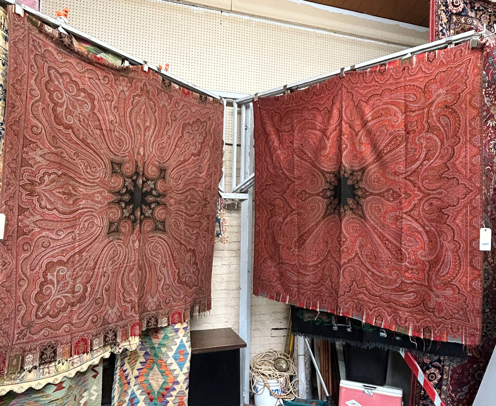 Lot of 2 Paisley Shawls or Wall Hangings, As Is.: Both pieces are cut on the top and the bottom of the shawls. One shawl has a 2" tear on the bottom right corner, and several holes. This one measures 5' 6" x 5' 7". The other shawl looks to be in good