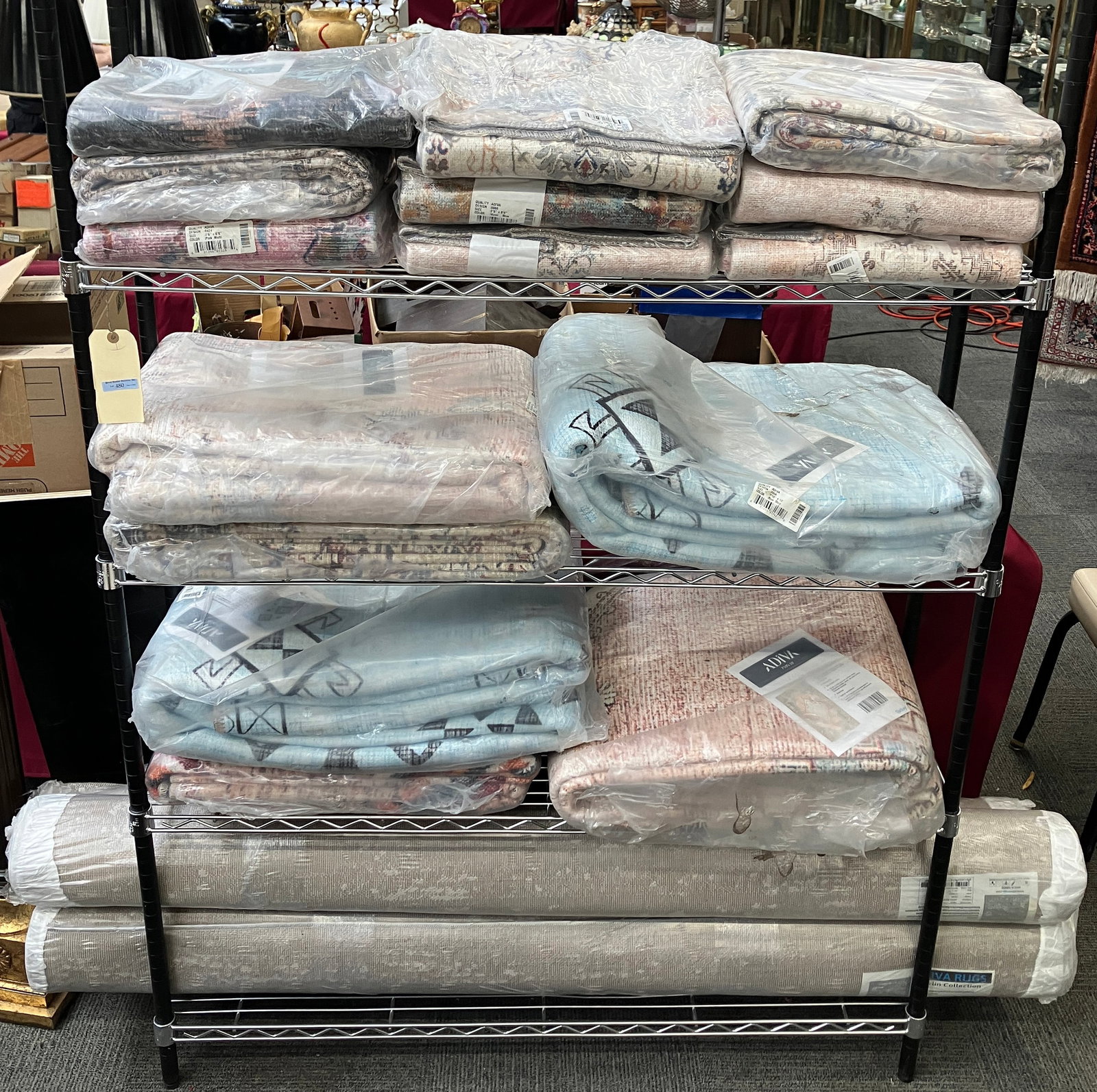 Lg. Lot of New Old Stock Rugs, Original Packaging.: The lot contains 19 rugs, all unopened. They vary in size from 2' 6" x 6' 6" to 7' 10" x 10'. Most, if not all of them, are by Adiva. 4 of them are rolled, not flat. This should be a bargain for any d