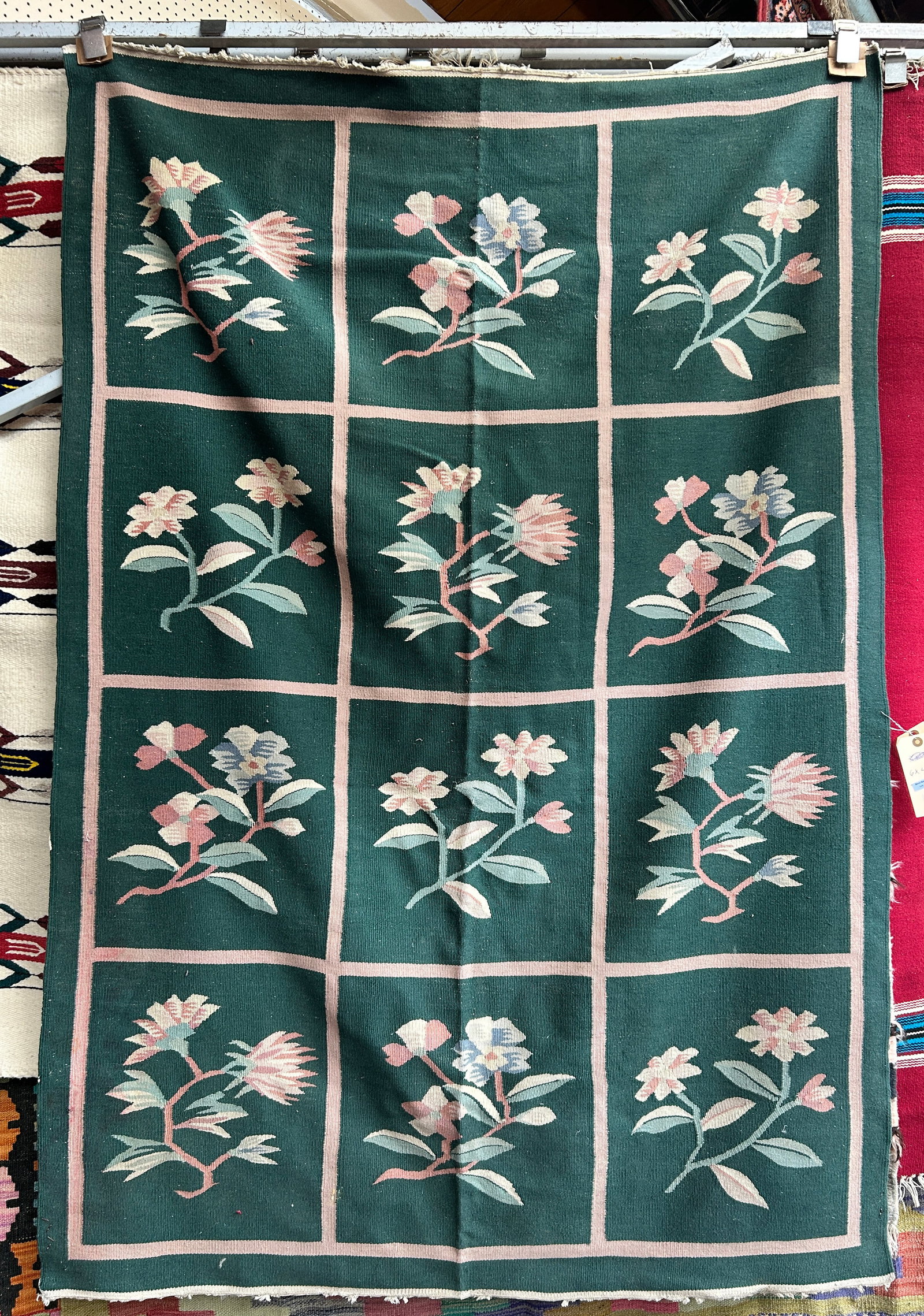 4' 1" x 6' Green Floral Kelim Rug.: The rug has a couple of slightly shredded spots, but is in good overall condition. In-house shipping is available. To receive the best shipping rate on this item, please check the "Self Arranged" butt