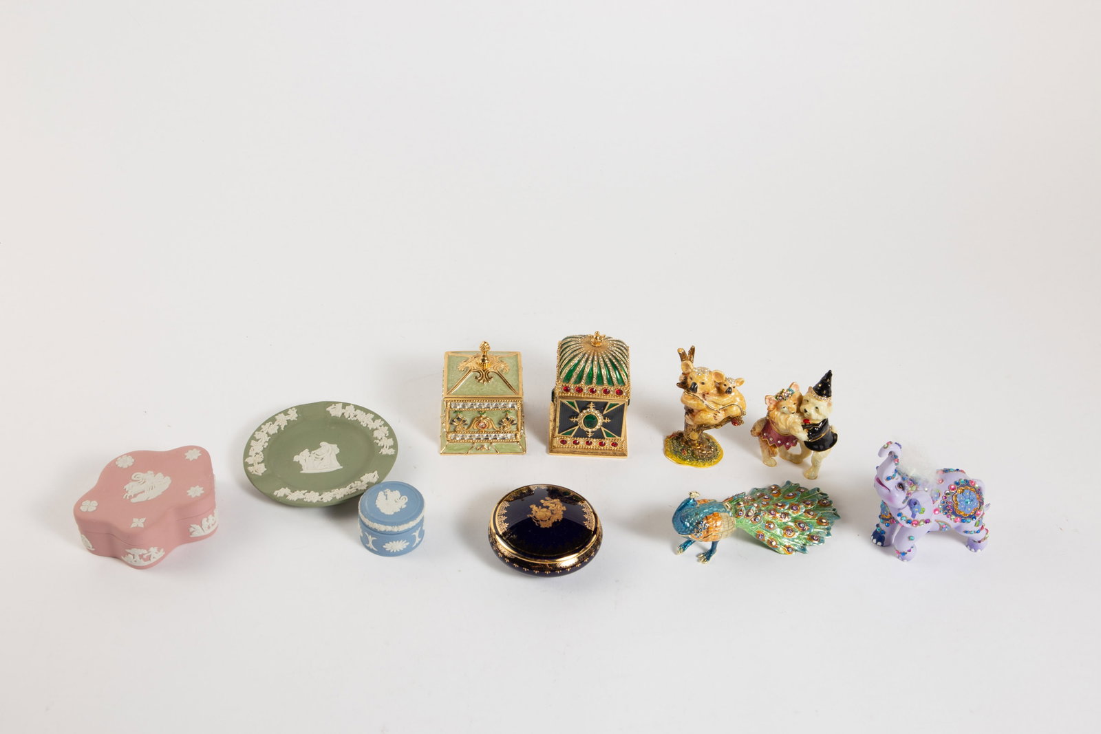 Lot: Enameled Trinket Boxes, Wedgwood Jasperware.: Overall, this lot looks to be in good condition. The enameled rhinestone boxes are shaped like a peacock, a pair of dancing dogs, a koala with her baby, and other items. The Wedgwood colors are