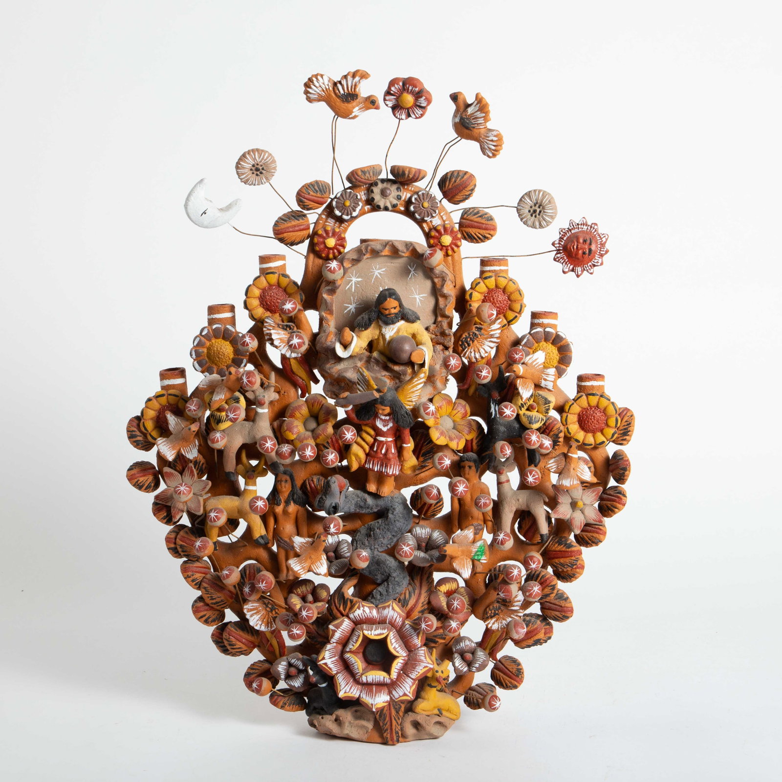 Mexican Folk Art Tree of Life Candelabra Sculpture: This Terra Cotta candelabra has six candleholders. Overall, it looks to be in Nice cosmetic condition. One of the animals has a Broken antler, and the angel in the center has a Broken stick. The