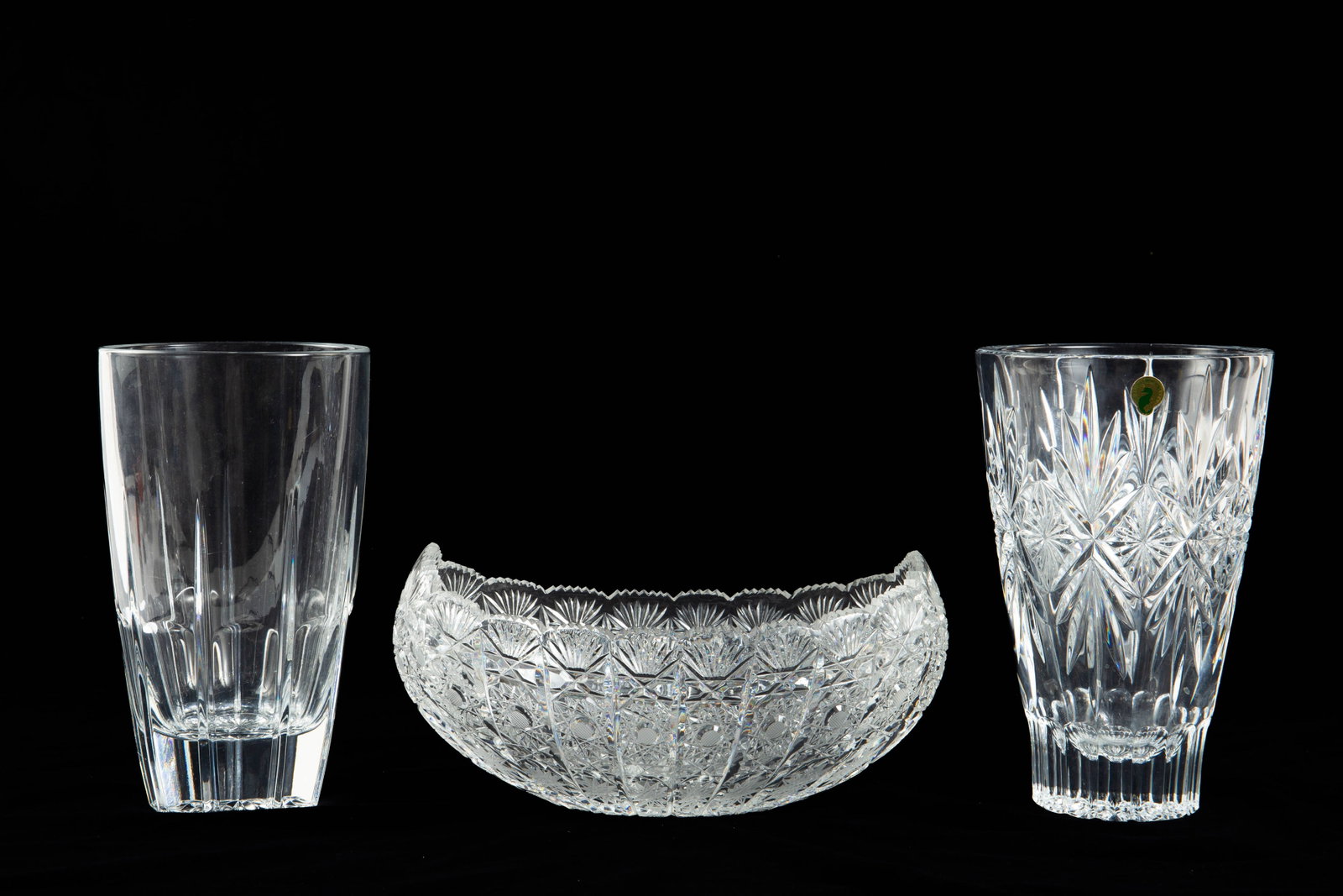 Lot of 3 Crystal Vases, Including Waterford.: This lot includes a Waterford "Normandy" vase, in nice condition, and two other vases (small chips). The largest item measures 12" x 7" x 5 3/4". The smallest item measures 5 5/8" x 5 5/8" x 9 3/4". I